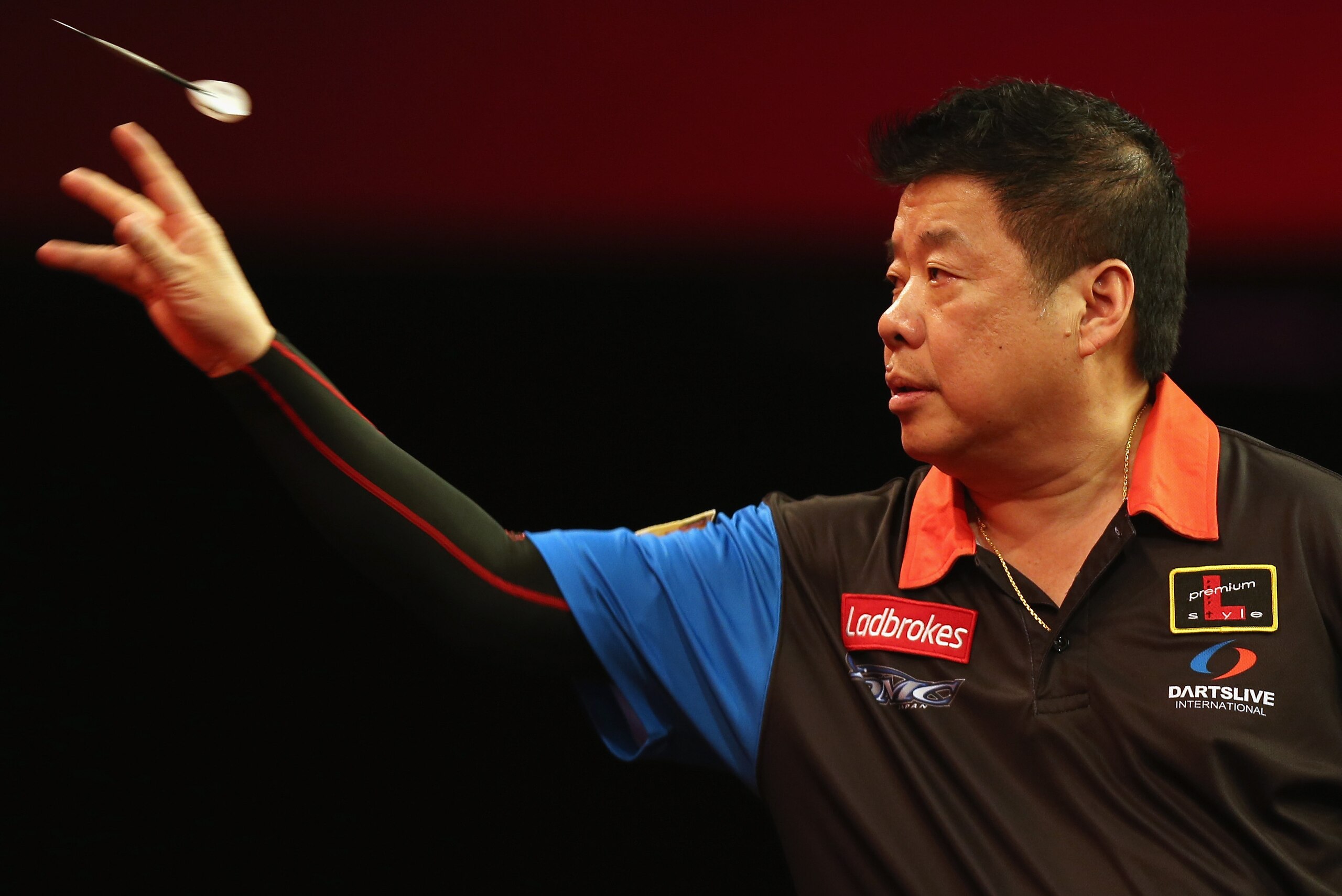 LONDON, ENGLAND - DECEMBER 20:  Paul Lim of Singapore throws against Michael van Gerwen of the Netherlands during his match on day seven of the 2013 Ladbrokes.com World Darts Championship at Alexandra Palace on December 20, 2012 in London, England.  (Phot
