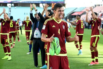 Venezuela's defender Nahuel Ferraresi (front) reacts after winning their U-20 World Cup quarter-final football match against the US in Jeonju on June 4, 2017.  / AFP PHOTO / JUNG Yeon-Je        (Photo credit should read JUNG YEON-JE/AFP/Getty Images)