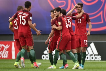 Portugal's forward Diogo Goncalves (C) is congratulate by teammates after scoring during their U-20 World Cup quarter-final football match between Portugal and Uruguay in Daejeon on June 4, 2017.  / AFP PHOTO / KIM DOO-HO        (Photo credit should read 