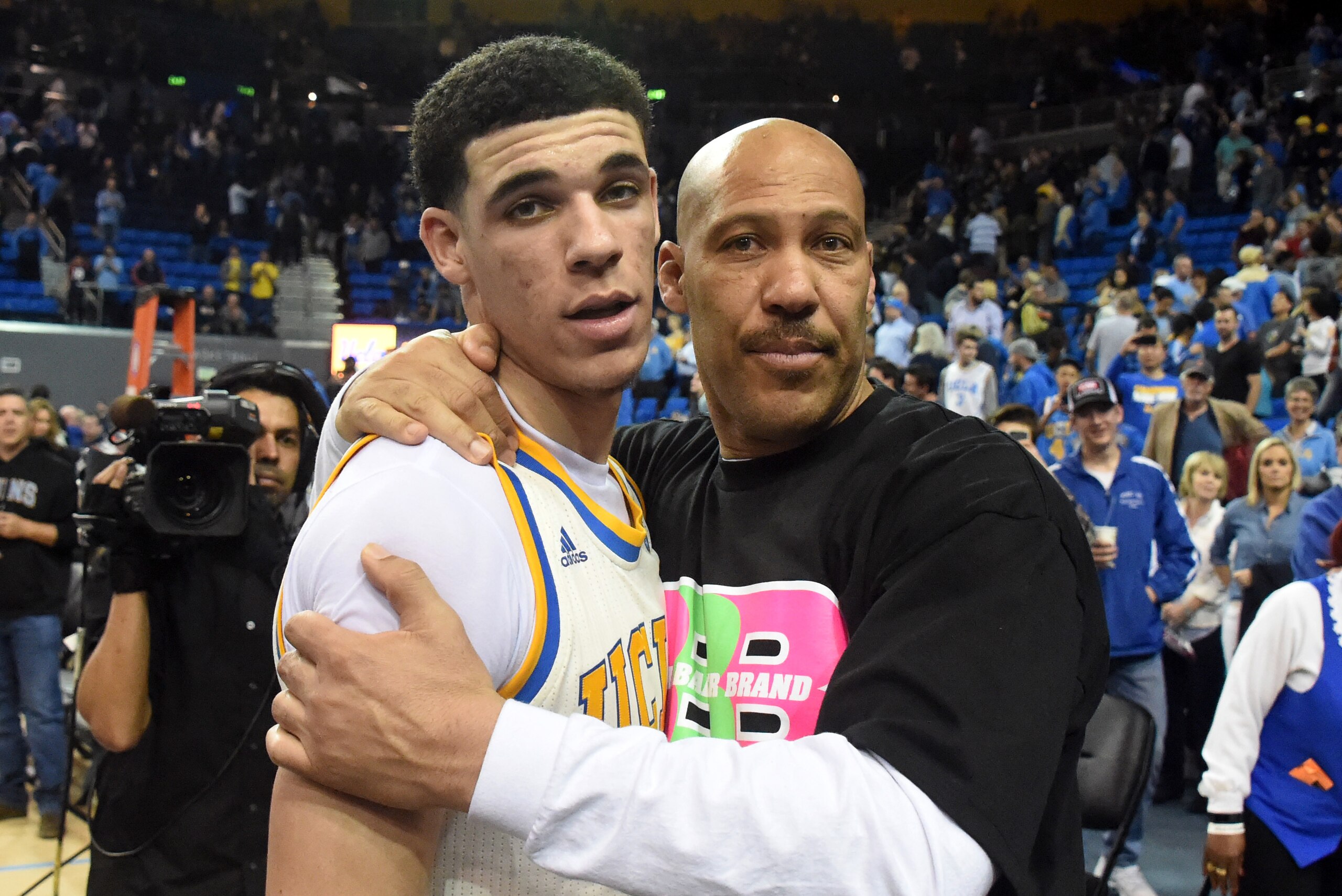 Mar 4, 2017; Los Angeles, CA, USA; Lavar Ball embraces his son UCLA Bruins guard Lonzo Ball (2) after the game against the Washington State Cougars at Pauley Pavilion. Mandatory Credit: Richard Mackson-USA TODAY Sports