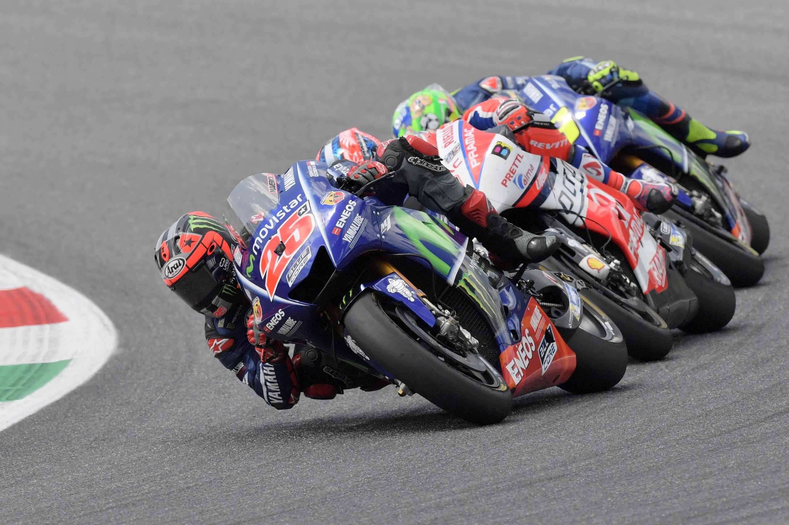 Movistar Yamaha's Spanish rider Maverick Vinales competes ahead OCTO Pramac Yakhnich's Italian rider Danilo Petrucci and Movistar Yamaha's Italian rider Valentino Rossi during the Moto GP Grand Prix at the Mugello race track on June 4, 2017. 
Ducati's And