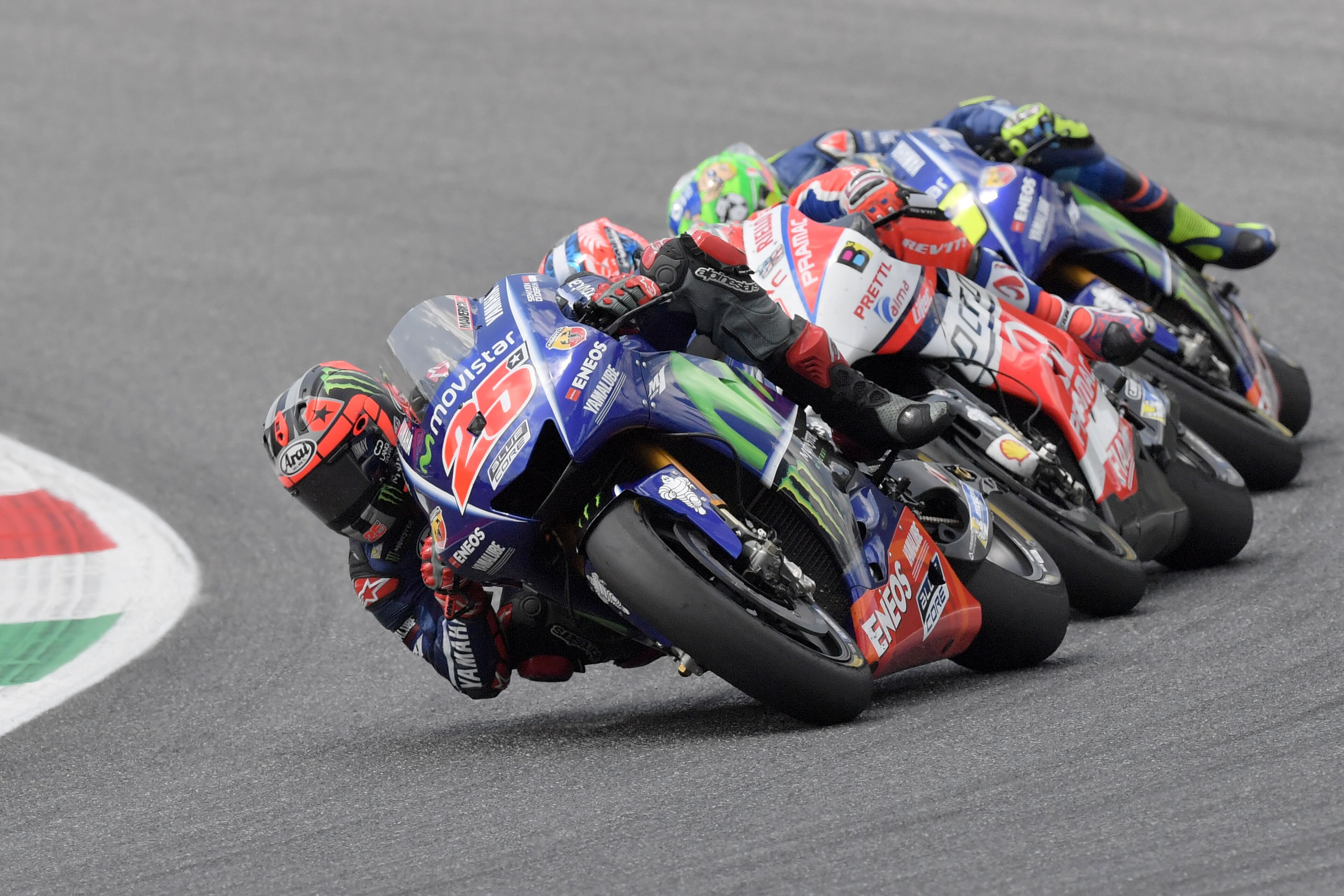 Movistar Yamaha's Spanish rider Maverick Vinales competes ahead OCTO Pramac Yakhnich's Italian rider Danilo Petrucci and Movistar Yamaha's Italian rider Valentino Rossi during the Moto GP Grand Prix at the Mugello race track on June 4, 2017. 
Ducati's And