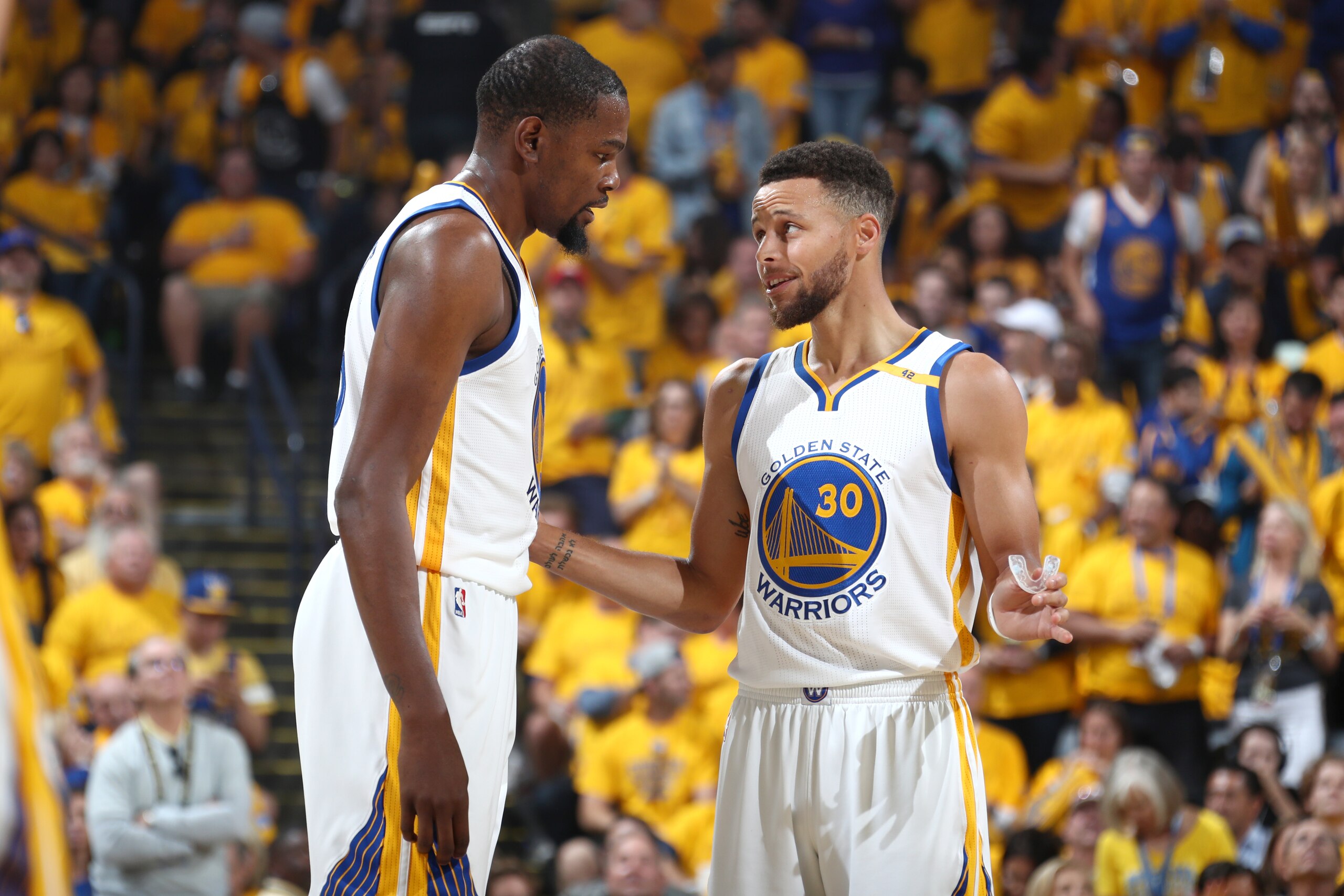 OAKLAND, CA - JUNE 4:  Kevin Durant #35 and Stephen Curry #30 of the Golden State Warriors talk during the game against the Cleveland Cavaliers in Game Two of the 2017 NBA Finals on June 4, 2017 at ORACLE Arena in Oakland, California. NOTE TO USER: User e