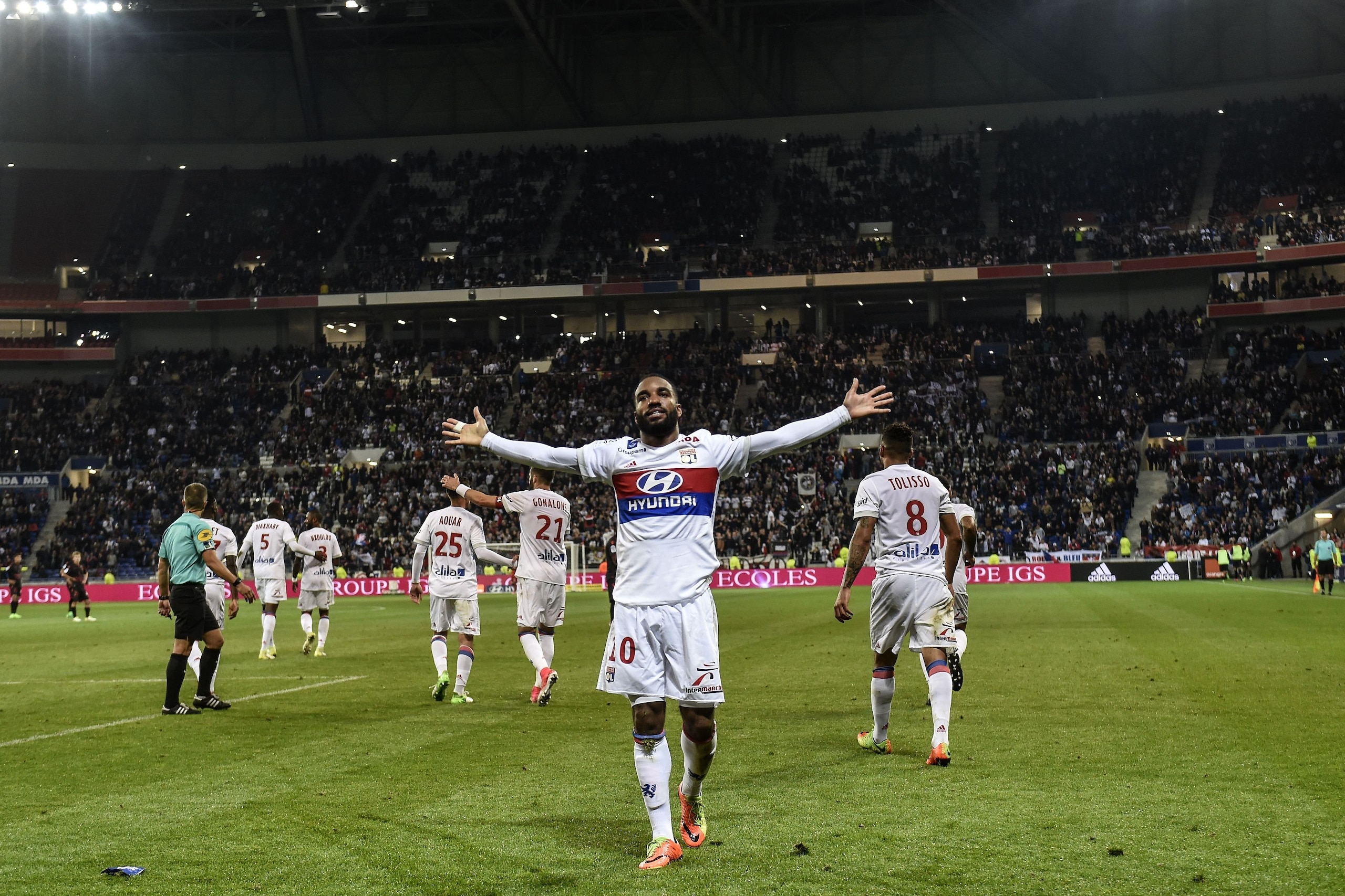 Lyon's French forward Alexandre Lacazette celebrates after scoring his 100th goal in Ligue 1 during the French L1 football match between Lyon (OL) and Nice (OGCN) on May 20, 2017, at the Parc Olympique Lyonnais stadium in Decines-Charpieu near Lyon, centr