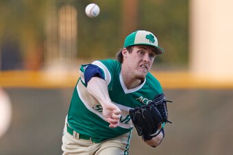 CORAL GABLES, FL - April 21: Pat Connaughton #24 of the Notre Dame Fighting Irish throws the ball against the Miami Hurricanes on April 21, 2014 at Alex Rodriguez Park at Mark Light Field in Coral Gables, Florida. Miami defeated Notre Dame 6-3. (Photo by 