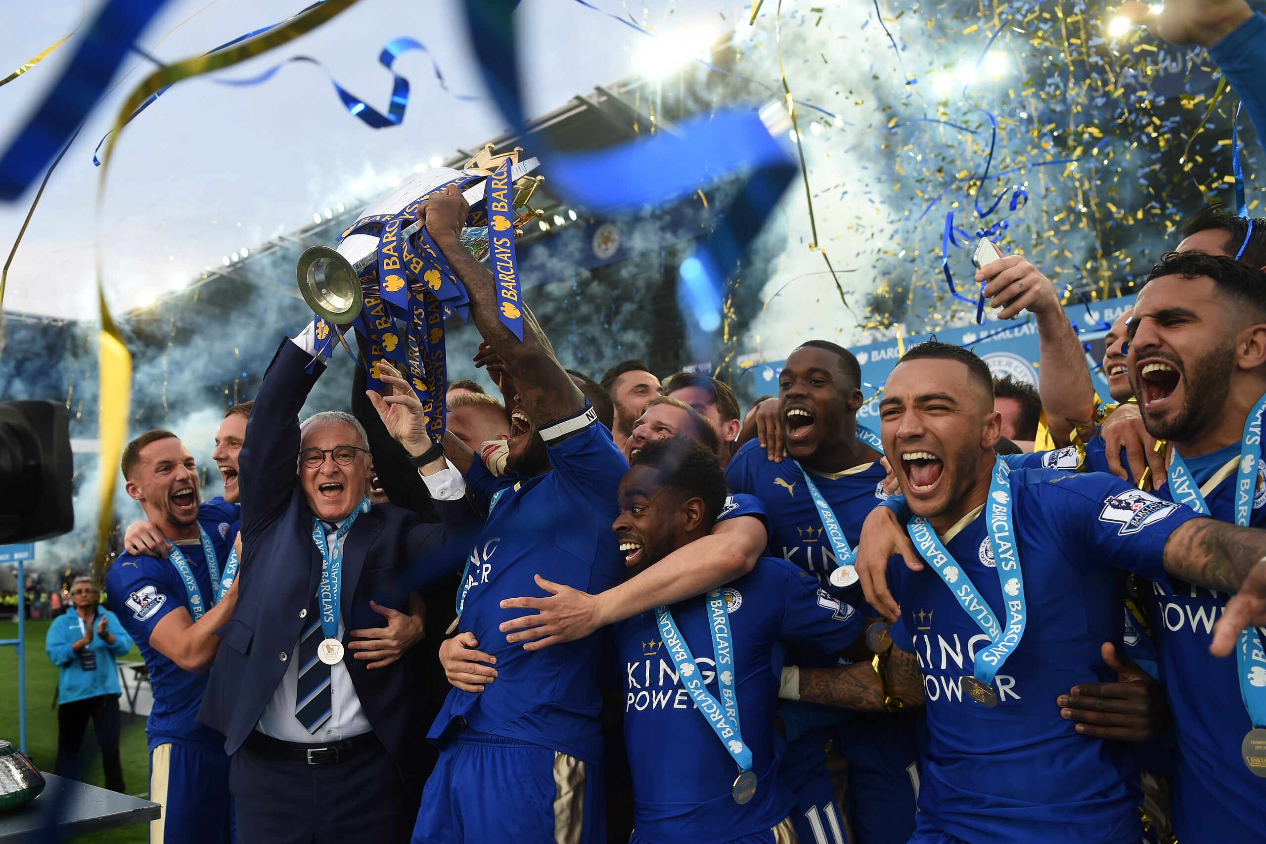 LEICESTER, ENGLAND - MAY 07: Captain Wes Morgan and manager Claudio Ranieri of Leicester City lift the Premier League Trophy after the Barclays Premier League match between Leicester City and Everton at The King Power Stadium on May 7, 2016 in Leicester, 