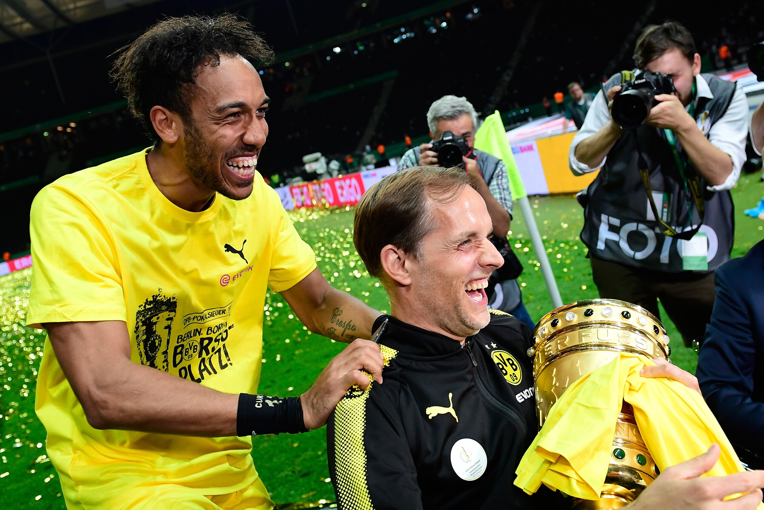 Dortmund's Gabonese forward Pierre-Emerick Aubameyang (L) and Dortmund's head coach Thomas Tuchel celebrate with the trophy after victory during the German Cup (DFB Pokal) final football match Eintracht Frankfurt v BVB Borussia Dortmund at the Olympic sta