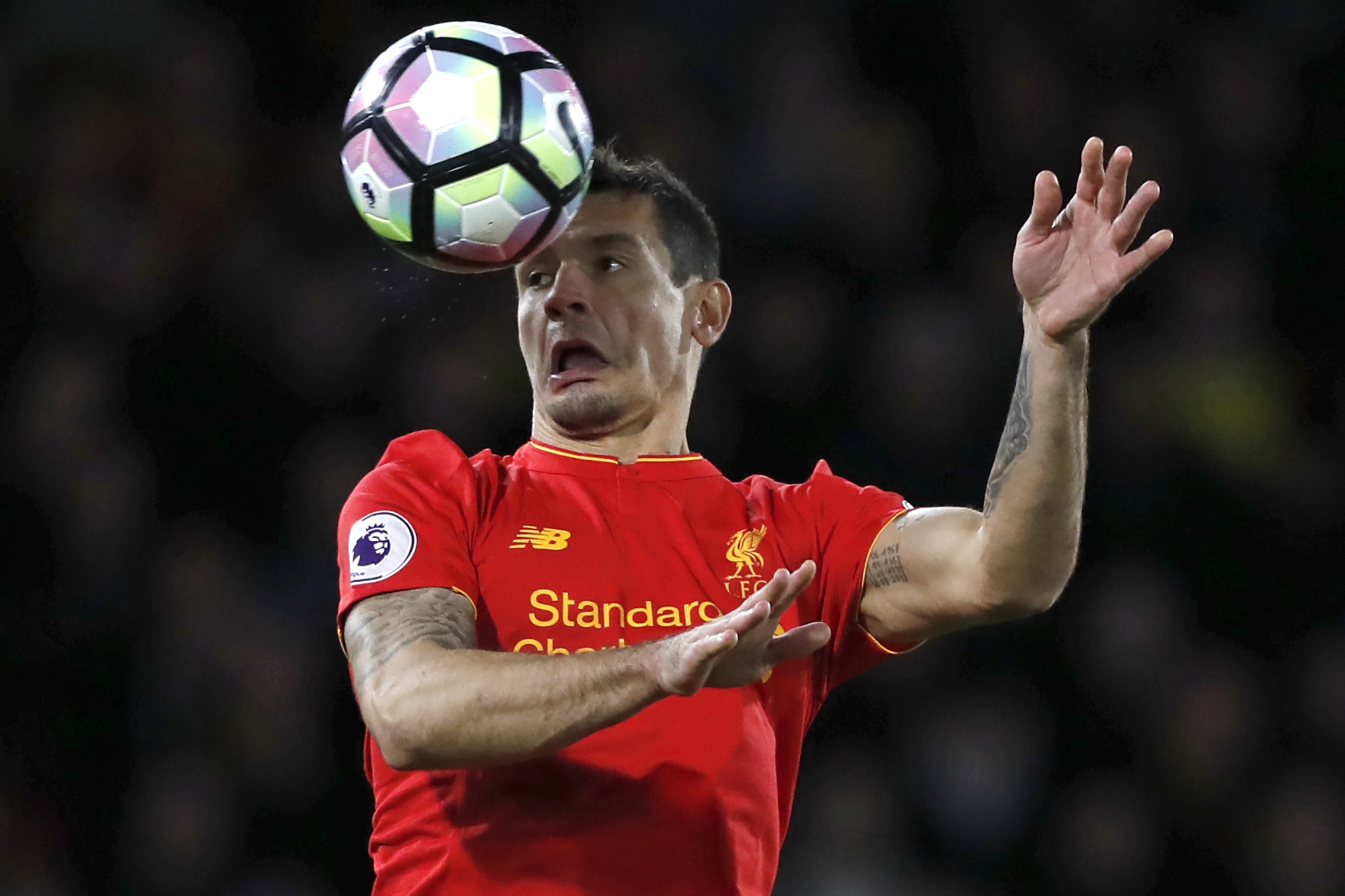 Liverpool's Croatian defender Dejan Lovren heads the ball during the English Premier League football match between Watford and Liverpool at Vicarage Road Stadium in Watford, north of London on May 1, 2017. / AFP PHOTO / Adrian DENNIS / RESTRICTED TO EDITO