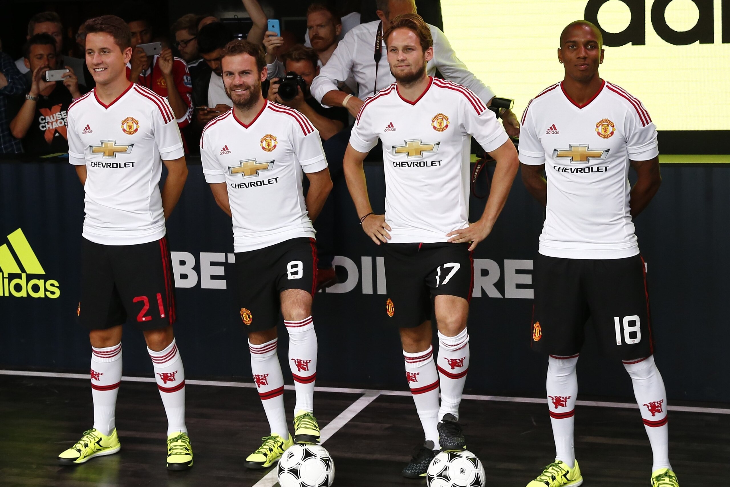 (L-R) Manchester United's Spanish midfielder Ander Herrera, Manchester United's Spanish midfielder Juan Mata, Manchester United's Dutch midfielder Daley Blind and Manchester United's English midfielder Ashley Young pose in the new Adidas away kit at a lau