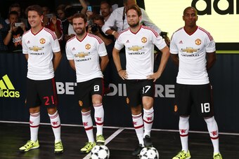 (L-R) Manchester United's Spanish midfielder Ander Herrera, Manchester United's Spanish midfielder Juan Mata, Manchester United's Dutch midfielder Daley Blind and Manchester United's English midfielder Ashley Young pose in the new Adidas away kit at a lau (L-R) Manchester United's Spanish midfielder Ander Herrera, Manchester United's Spanish midfielder Juan Mata, Manchester United's Dutch midfielder Daley Blind and Manchester United's English midfielder Ashley Young pose in the new Adidas away kit at a lau