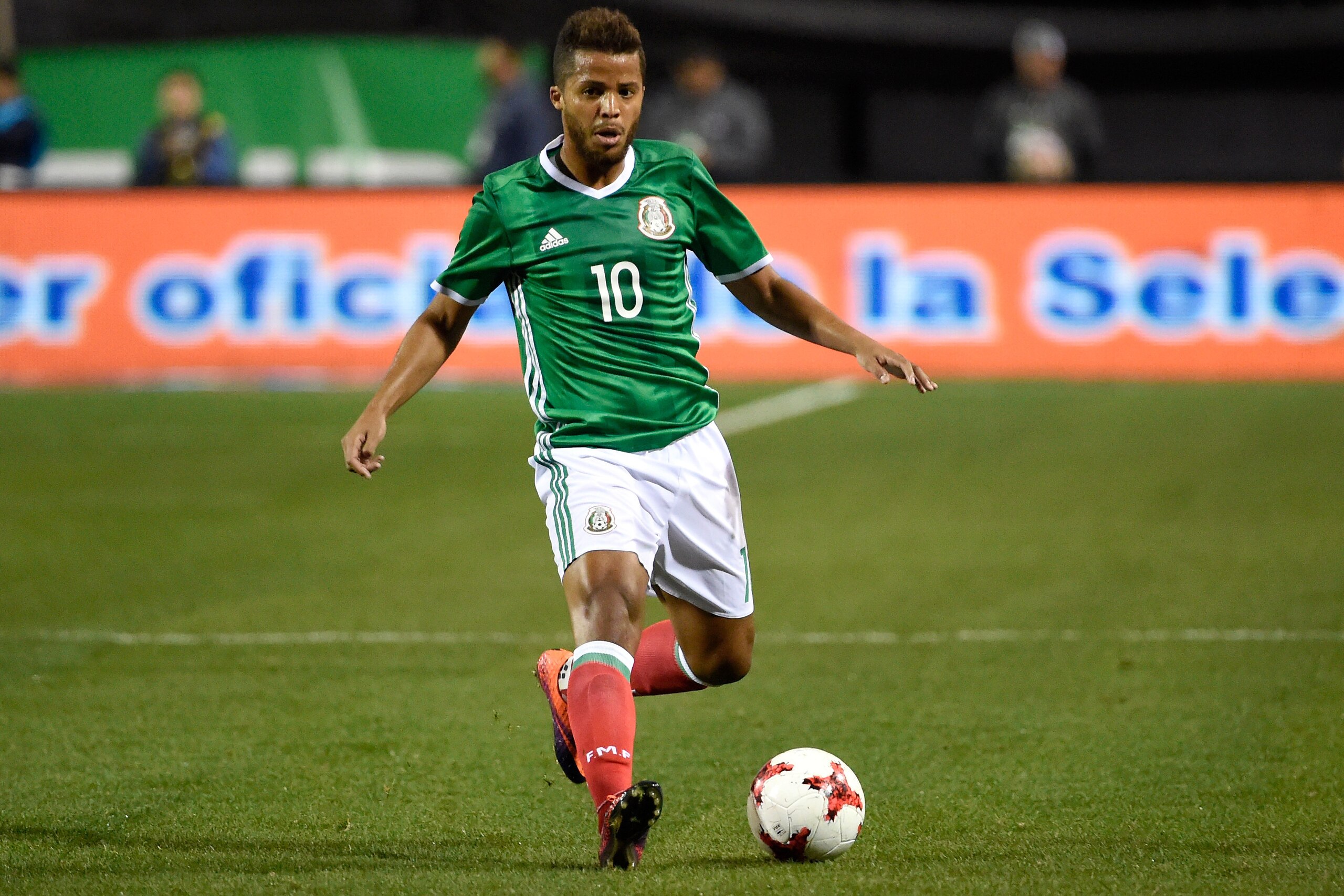 LAS VEGAS, NV - FEBRUARY 08: Giovani Dos Santos #10 of Mexico drives the ball against Iceland during the first half of their exhibition match at Sam Boyd Stadium on February 8, 2017 in Las Vegas, Nevada. Mexico won 1-0. (Photo by David J. Becker/Getty I LAS VEGAS, NV - FEBRUARY 08: Giovani Dos Santos #10 of Mexico drives the ball against Iceland during the first half of their exhibition match at Sam Boyd Stadium on February 8, 2017 in Las Vegas, Nevada. Mexico won 1-0. (Photo by David J. Becker/Getty I