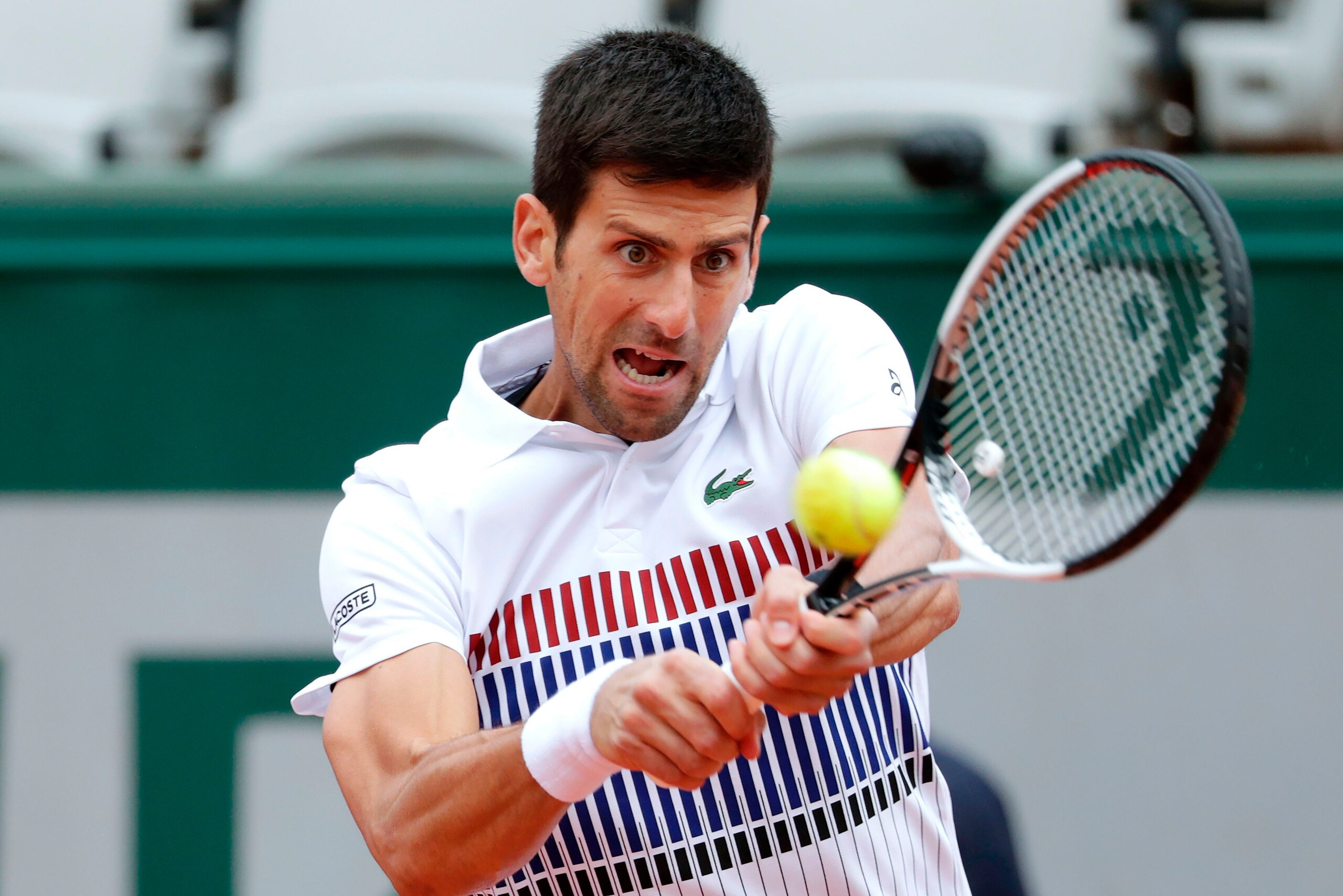 Serbia's Novak Djokovic returns the ball to Austria's Dominic Thiem during their tennis match at the Roland Garros 2017 French Open on June 7, 2017 in Paris.  / AFP PHOTO / Thomas SAMSON        (Photo credit should read THOMAS SAMSON/AFP/Getty Images)