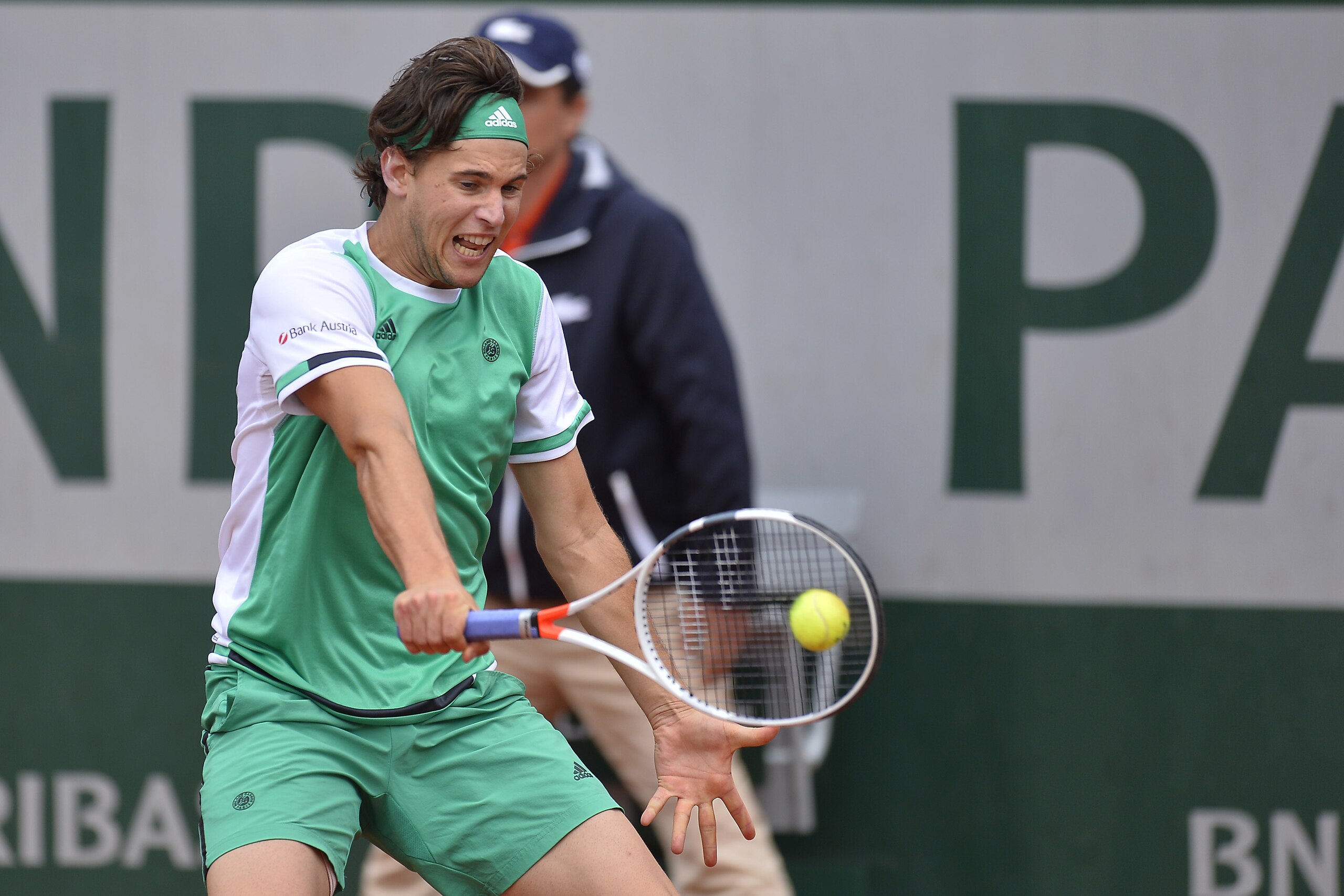 PARIS, FRANCE - JUNE 07:  Dominic Thiem of Austria plays a backhand during the men's singles quarterfinal match against Novak Djokovic of Serbia on day eleven of the 2017 French Open at Roland Garros on June 7, 2017 in Paris, France.  (Photo by Aurelien M