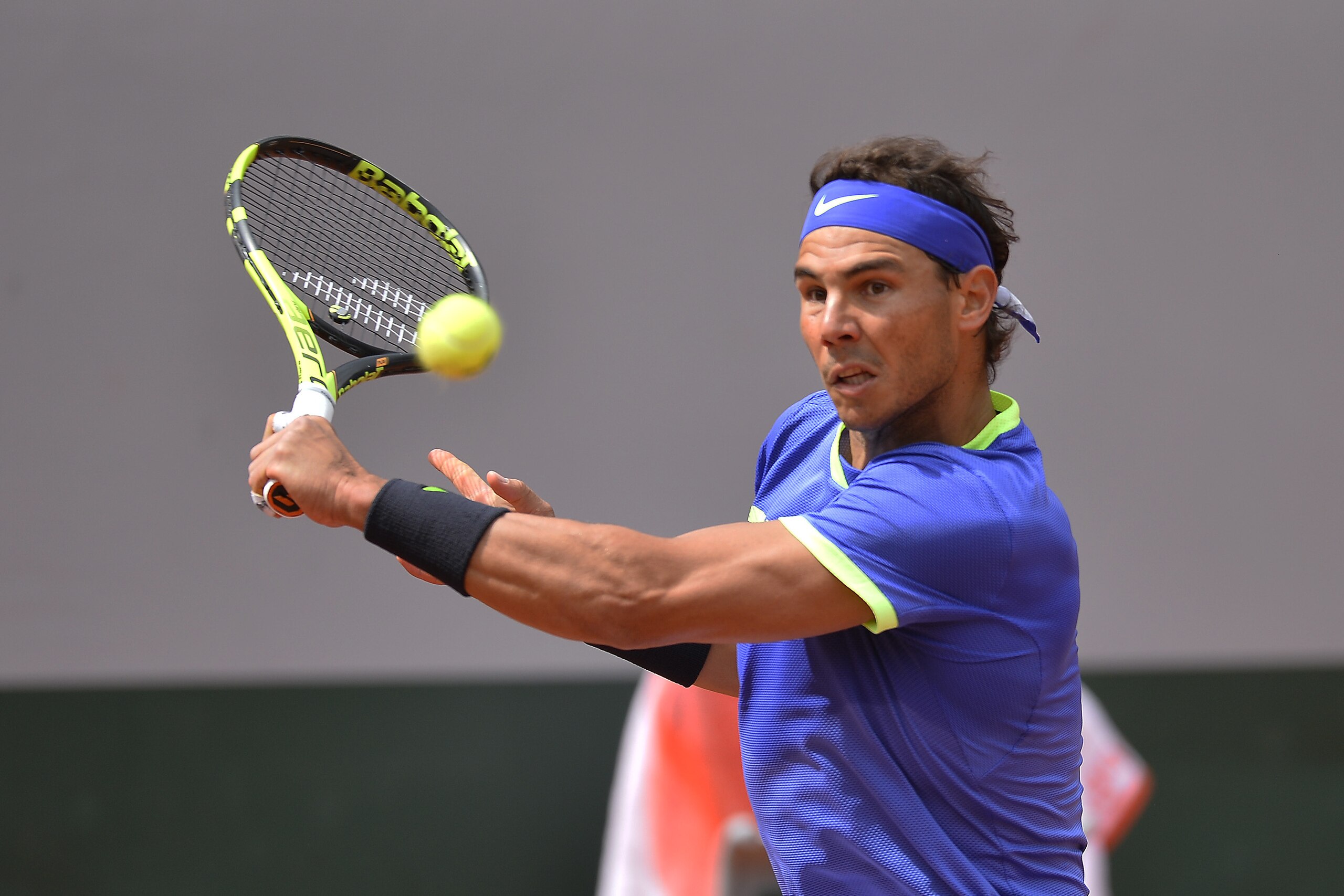 PARIS, FRANCE - JUNE 07:  Rafael Nadal of Spain plays a backhand during the men's singles quarterfinal match against Pablo Carreno Busta of Spain on day eleven of the 2017 French Open at Roland Garros on June 7, 2017 in Paris, France.  (Photo by Aurelien 