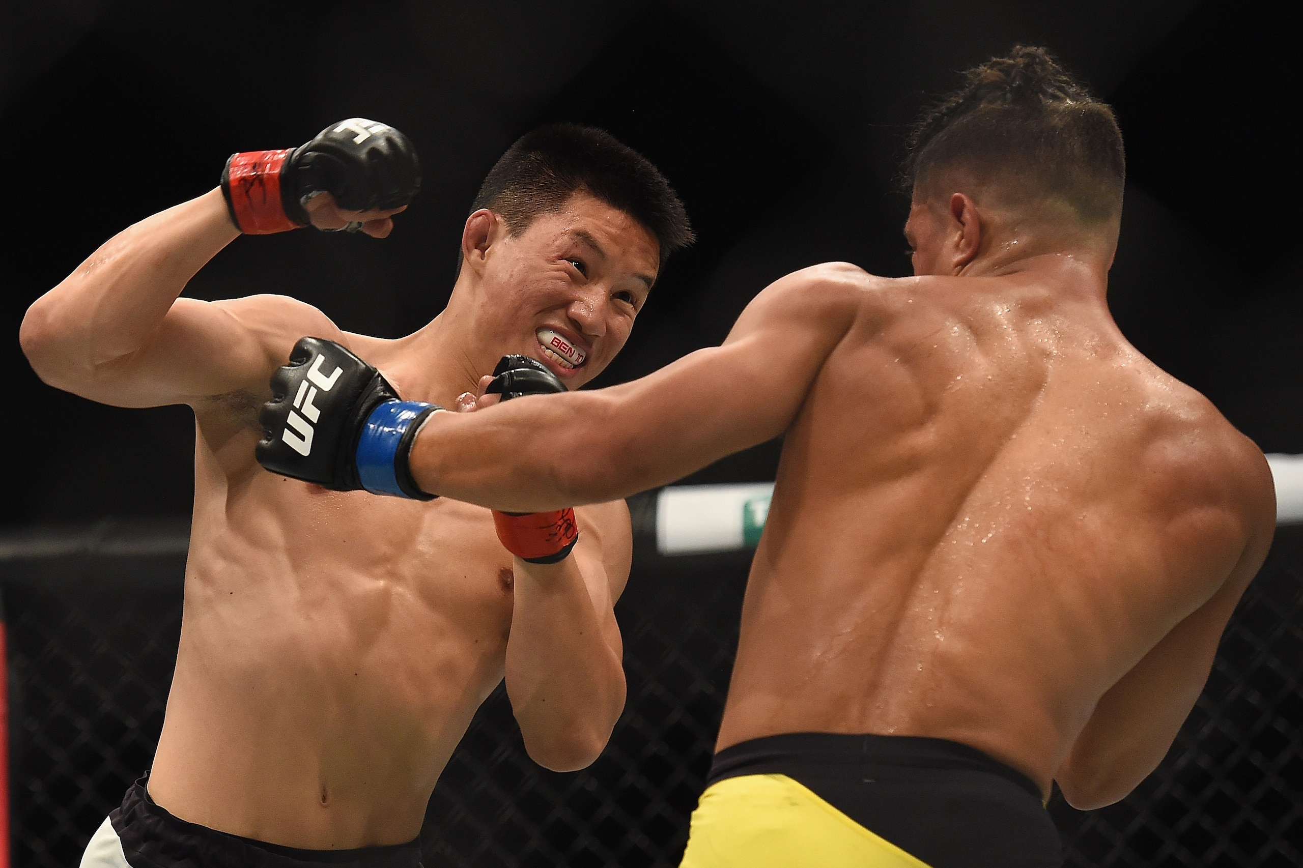Nov 27, 2016; Melbourne, Australia; Ben Nguyen (red gloves) competes against Geane Herrera (blue gloves) during UFC Fight Night at Rod Laver Arena. Mandatory Credit: Matt Roberts-USA TODAY Sports