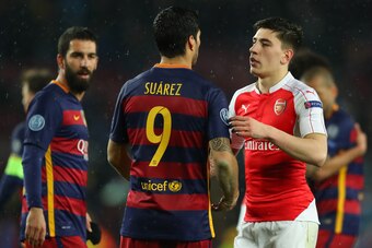 BARCELONA, SPAIN - MARCH 16: Luis Suarez (C) of Barcelona and Hector Bellerin (R) of Arsenal shake hands after the UEFA Champions League round of 16, second Leg match between FC Barcelona and Arsenal FC at Camp Nou on March 16, 2016 in Barcelona, Spain.  