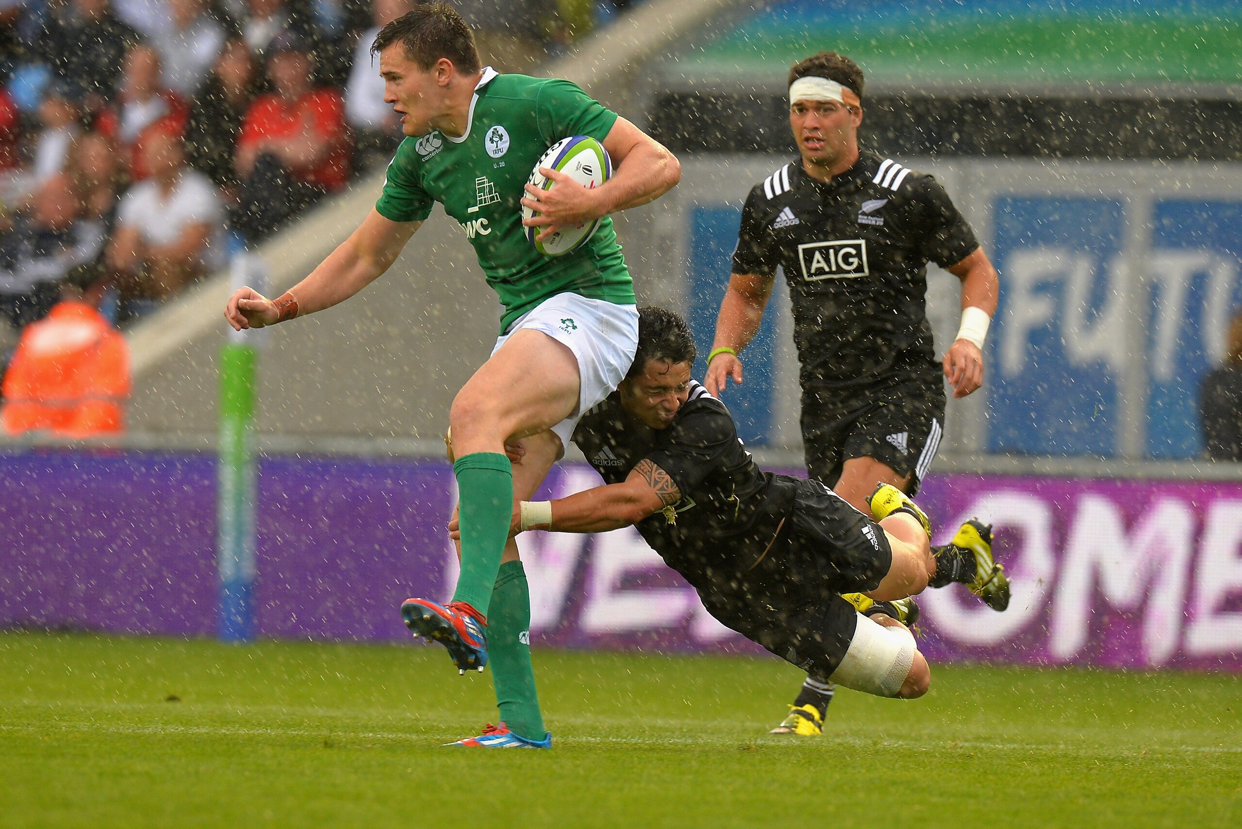 MANCHESTER, ENGLAND - JUNE 11:  TJ Vaa of New Zealand  tackles Jacob Stockdale of Ireland during the World Rugby U20 Championship match between  New Zealand and Ireland at The Academy Stadium on June 11, 2016 in Manchester, England.  (Photo by Tony Marsha