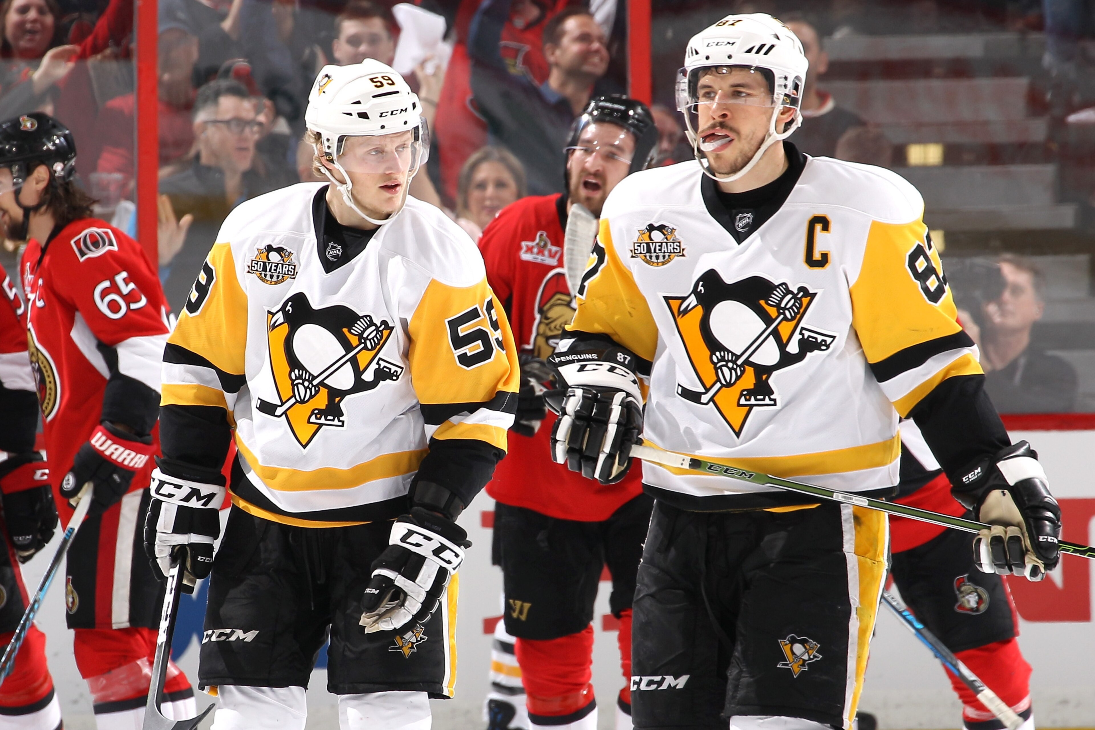OTTAWA, ON - MAY 17:  Sidney Crosby #87 and Jake Guentzel #59 of the Pittsburgh Penguins react after the fourth goal scored by Ottawa Senators during the first period in Game Three of the Eastern Conference Final during the 2017 NHL Stanley Cup Playoffs a