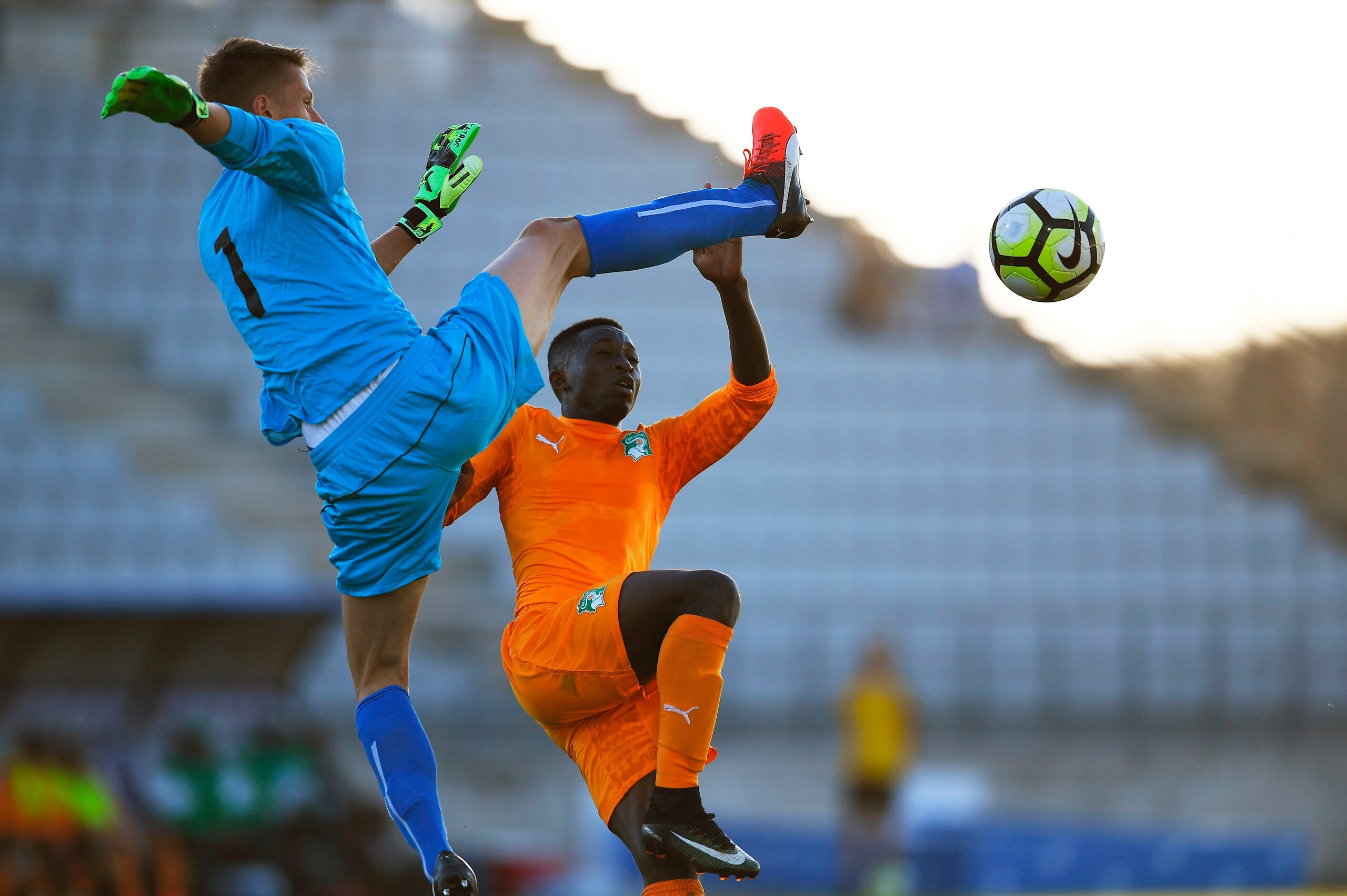 Czech Republic's goalkeeper Jan Plachy (L) vies with Ivory Coast's Jean Thiery Lazare Amani (R) during the Under 21 international football semi- final match Ivory Coast vs Czech Republic, at the Parsemain Stadium in Fos-sur-Mer, southern France on June 8,