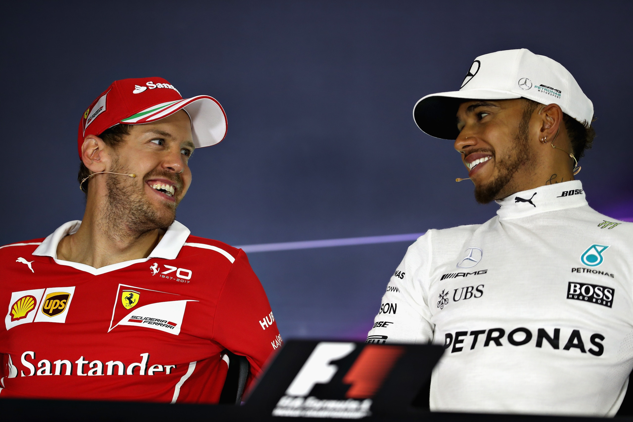 MONTMELO, SPAIN - MAY 14: Sebastian Vettel of Germany driving the (5) Scuderia Ferrari SF70H and Lewis Hamilton of Great Britain and Mercedes GP talk in the post race press conference during the Spanish Formula One Grand Prix at Circuit de Catalunya on Ma
