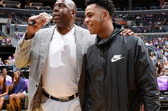 LOS ANGELES, CA - AUGUST 30: Los Angeles Sparks Owner Magic Johnson interviews D'Angelo Russell #1 of the Los Angeles Lakers during a game between the Los Angeles Sparks and the San Antonio Stars at STAPLES Center on August 30, 2015 in Los Angeles, Califo