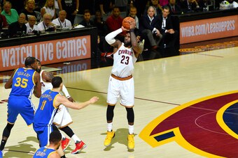 CLEVELAND, OH - JUNE 9: LeBron James #23 of the Cleveland Cavaliers shoots a three point basket during the game against the Golden State Warriors in Game Four of the 2017 NBA Finals on June 9, 2017 at The Quicken Loans Arena in Cleveland, Ohio. NOTE TO US