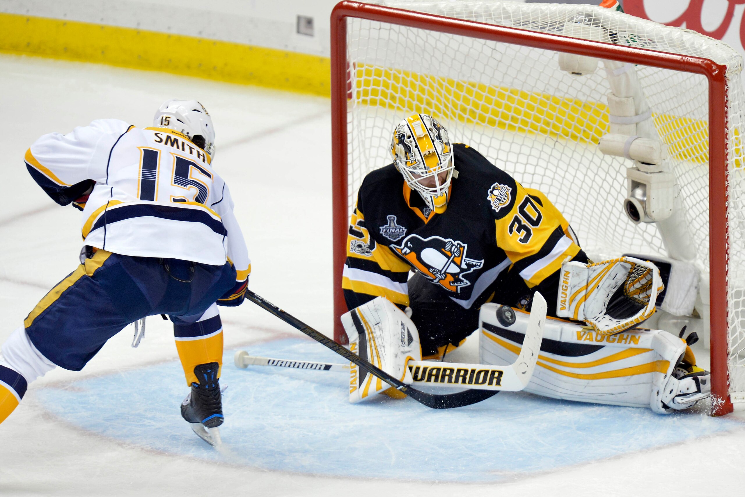 Jun 8, 2017; Pittsburgh, PA, USA; Pittsburgh Penguins goalie Matt Murray (30) blocks a shot against Nashville Predators center Craig Smith (15) during the third period in game five of the 2017 Stanley Cup Final at PPG PAINTS Arena. Mandatory Credit: Don W Jun 8, 2017; Pittsburgh, PA, USA; Pittsburgh Penguins goalie Matt Murray (30) blocks a shot against Nashville Predators center Craig Smith (15) during the third period in game five of the 2017 Stanley Cup Final at PPG PAINTS Arena. Mandatory Credit: Don W