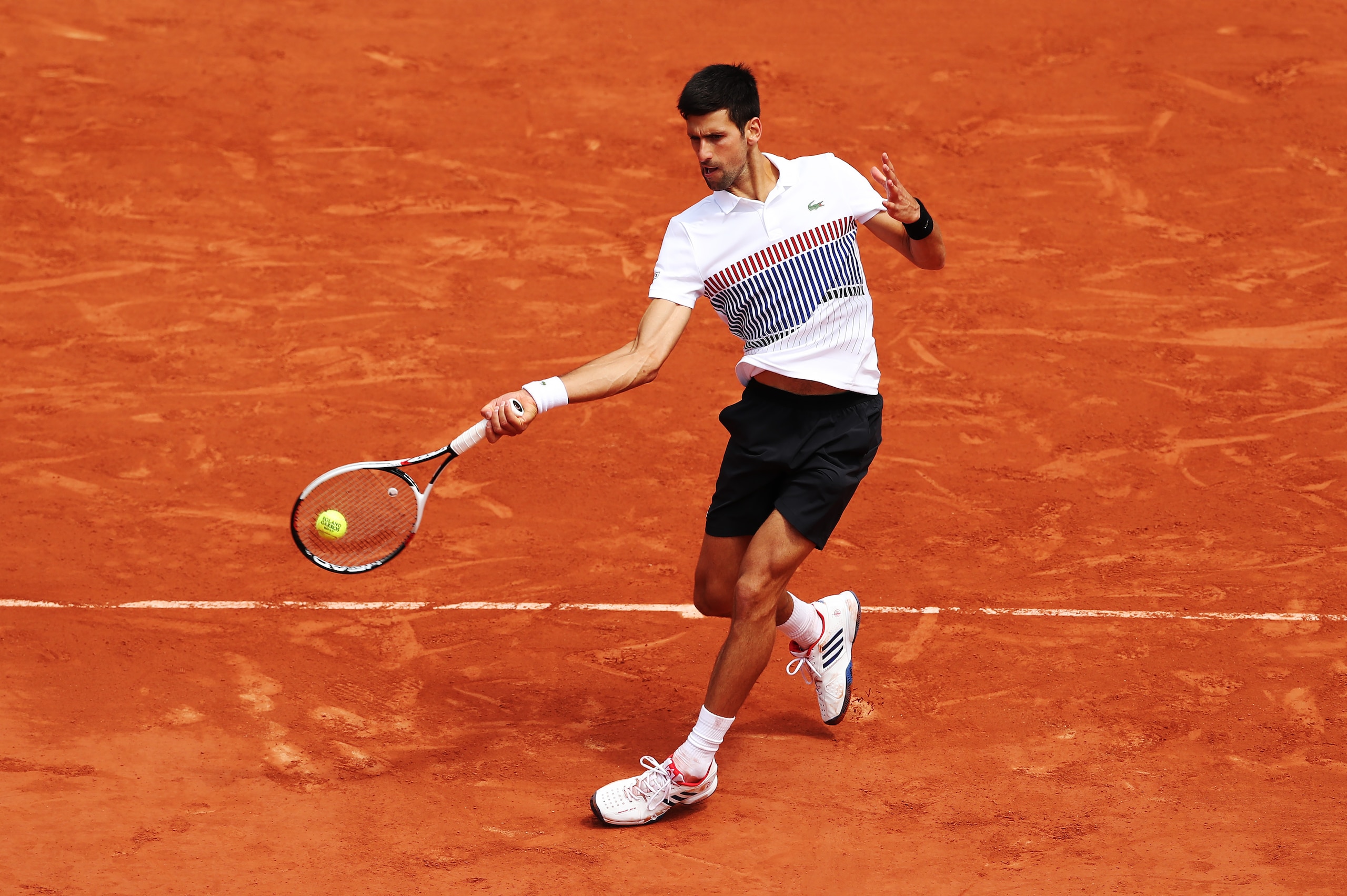 PARIS, FRANCE - JUNE 07: Novak Djokovic of Serbia plays a forehand shot during his match with Dominic Thiem of Austria, on day eleven at Roland Garros on June 7, 2017 in Paris, France. (Photo by Ian MacNicol/Getty Images)