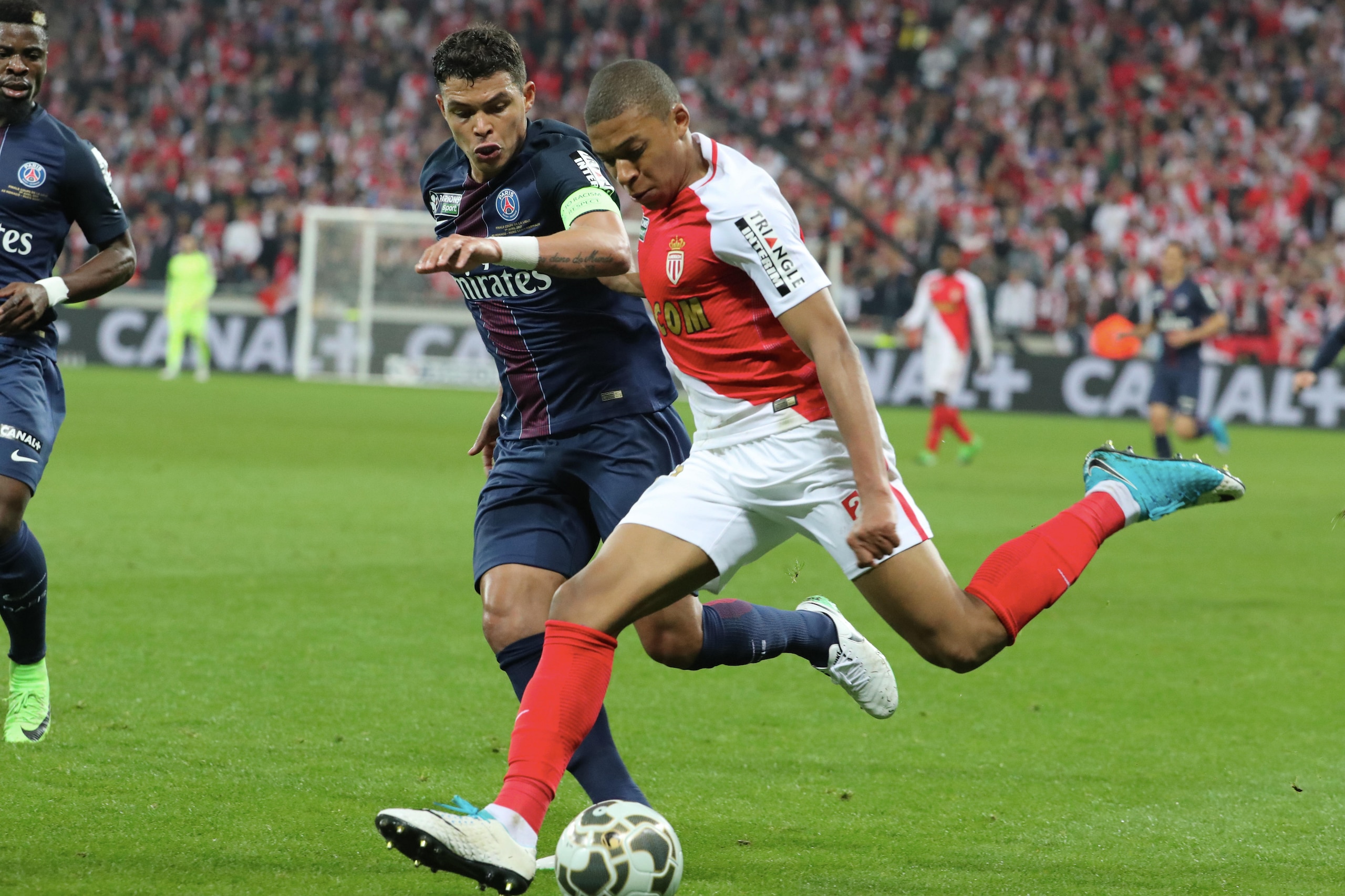 LYON, FRANCE - APRIL 01:  Kylian Mbappe of AS Monaco in action with Thiago Silva of Paris Saint-Germain during the French League Cup Final match between Paris Saint-Germain and AS Monaco at Parc Olympique on  Japril 01, 2017 in Lyon, France.  (Photo by Xa