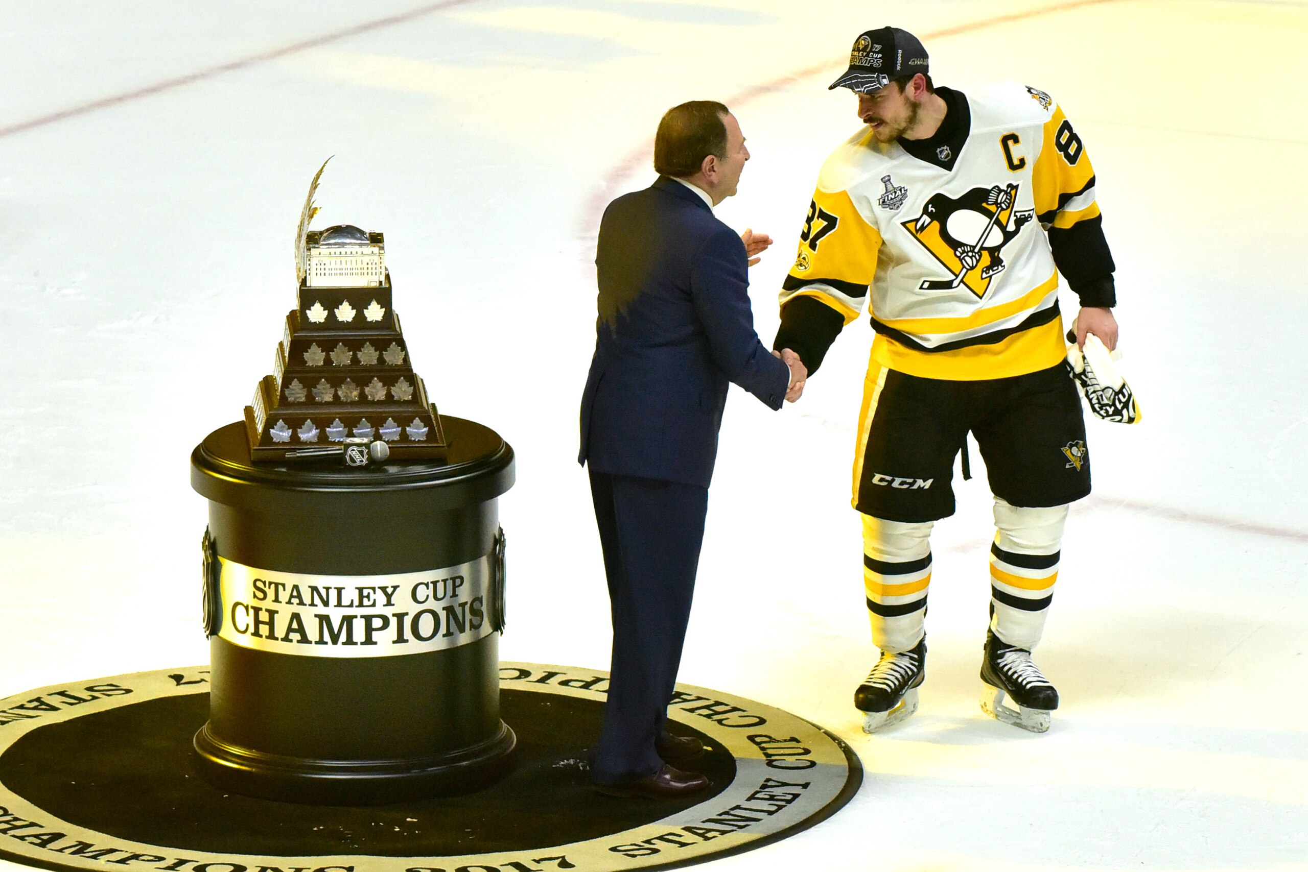 NASHVILLE, TN - JUNE 11:  NHL Commissioner Gary Bettman presents Sidney Crosby #87 of the Pittsburgh Penguins with the Conn Smythe Trophy for MVP after his teams 2-0 win over the Nashville Predators in Game Six of the 2017 NHL Stanley Cup Final at the Bri