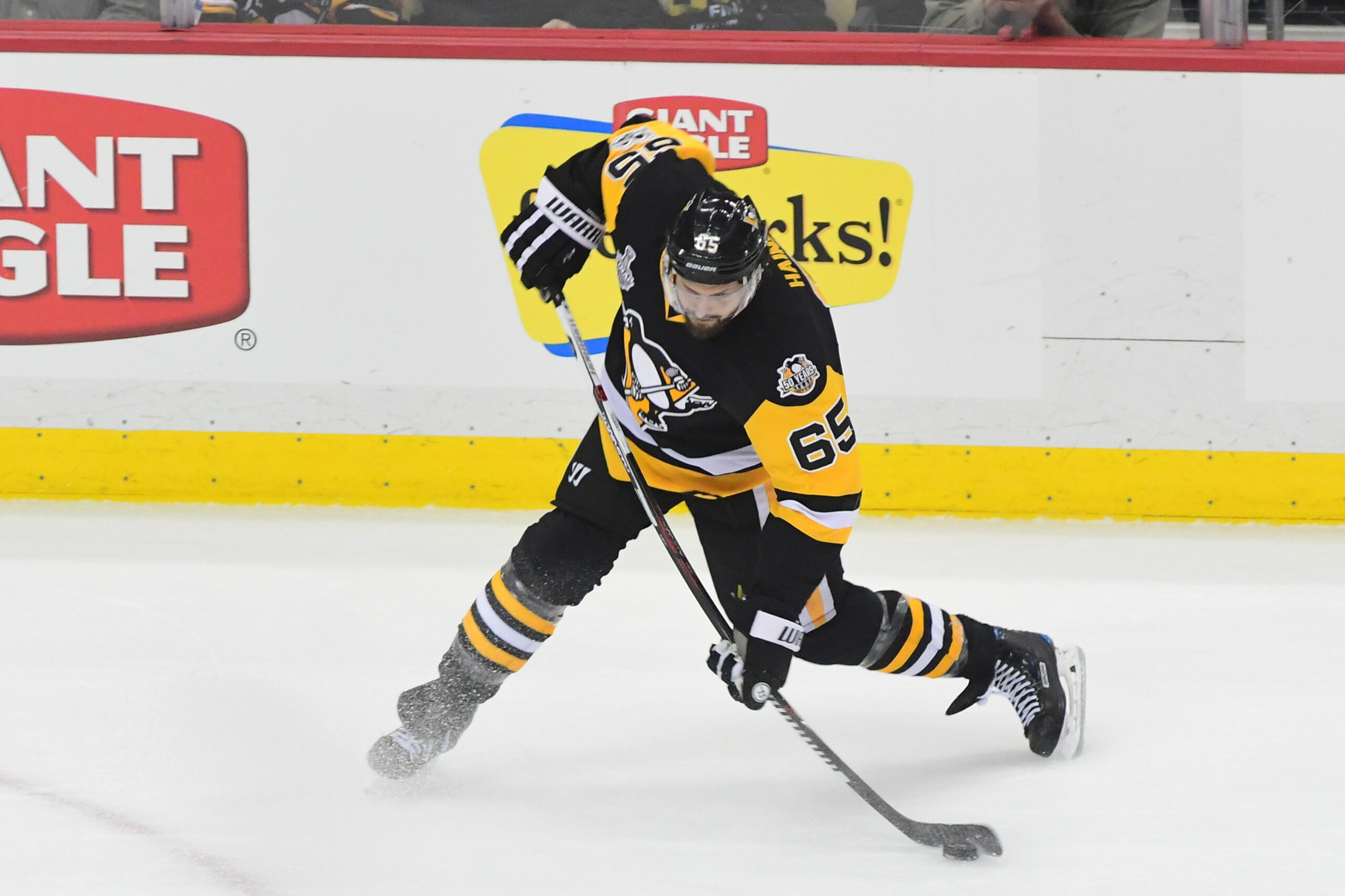 PITTSBURGH, PA - JUNE 08: Ron Hainsey #65 of the Pittsburgh Penguins takes a shot on goal against the Nashville Predators during the first period in Game Five of the 2017 NHL Stanley Cup Final at PPG PAINTS Arena on June 8, 2017 in Pittsburgh, Pennsylvani PITTSBURGH, PA - JUNE 08: Ron Hainsey #65 of the Pittsburgh Penguins takes a shot on goal against the Nashville Predators during the first period in Game Five of the 2017 NHL Stanley Cup Final at PPG PAINTS Arena on June 8, 2017 in Pittsburgh, Pennsylvani