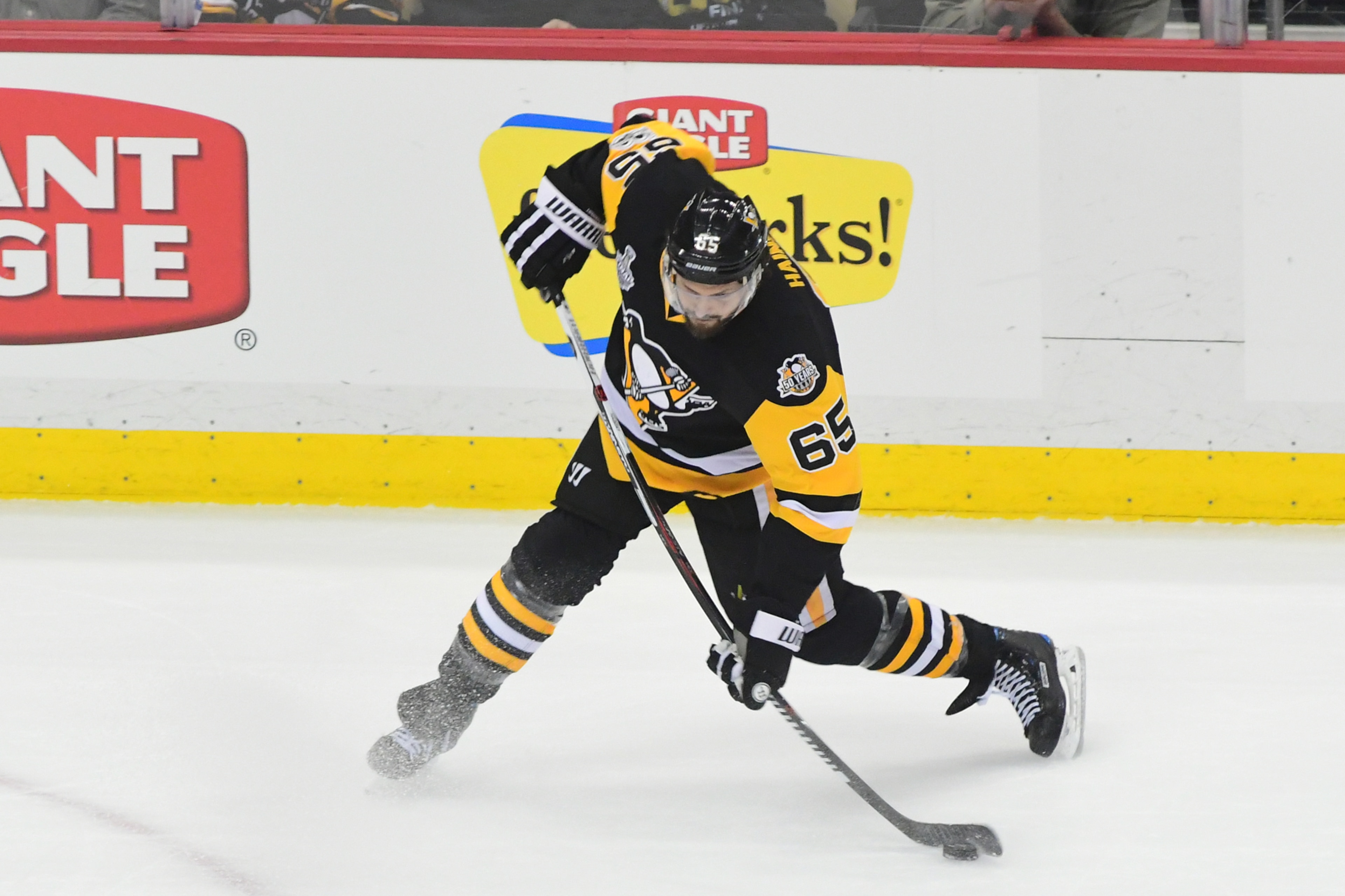 PITTSBURGH, PA - JUNE 08: Ron Hainsey #65 of the Pittsburgh Penguins takes a shot on goal against the Nashville Predators during the first period in Game Five of the 2017 NHL Stanley Cup Final at PPG PAINTS Arena on June 8, 2017 in Pittsburgh, Pennsylvani