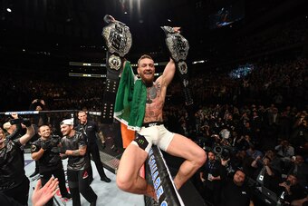 NEW YORK, NY - NOVEMBER 12:  UFC lightweight and featherweight champion Conor McGregor of Ireland celebrates after defeating Eddie Alvarez in their UFC lightweight championship fight during the UFC 205 event at Madison Square Garden on November 12, 2016 i