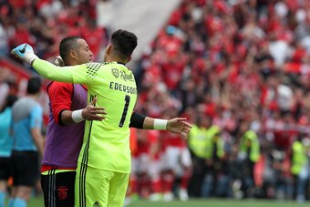 LISBON, PORTUGAL - MAY 13: Benfica's goalkeeper Julio Cesar from Brasil (R) and Benfica's goalkeeper Ederson Moares from Brasil (L) celebrates benfica frist goal scored by Benfica's midfielder Franco Cervi from Argentina  during the match between SL Benfi