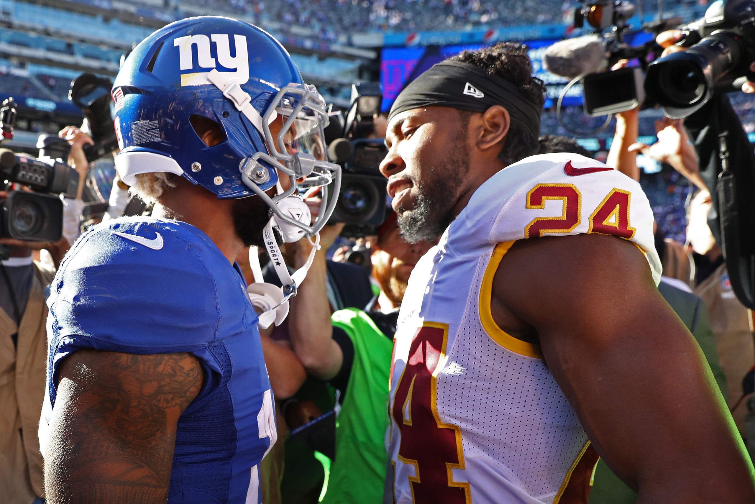 EAST RUTHERFORD, NJ - SEPTEMBER 25:  Odell Beckham #13 of the New York Giants and  Josh Norman #24 of the Washington Redskins exchange words after the game at MetLife Stadium on September 25, 2016 in East Rutherford, New Jersey.  (Photo by Al Bello/Getty 