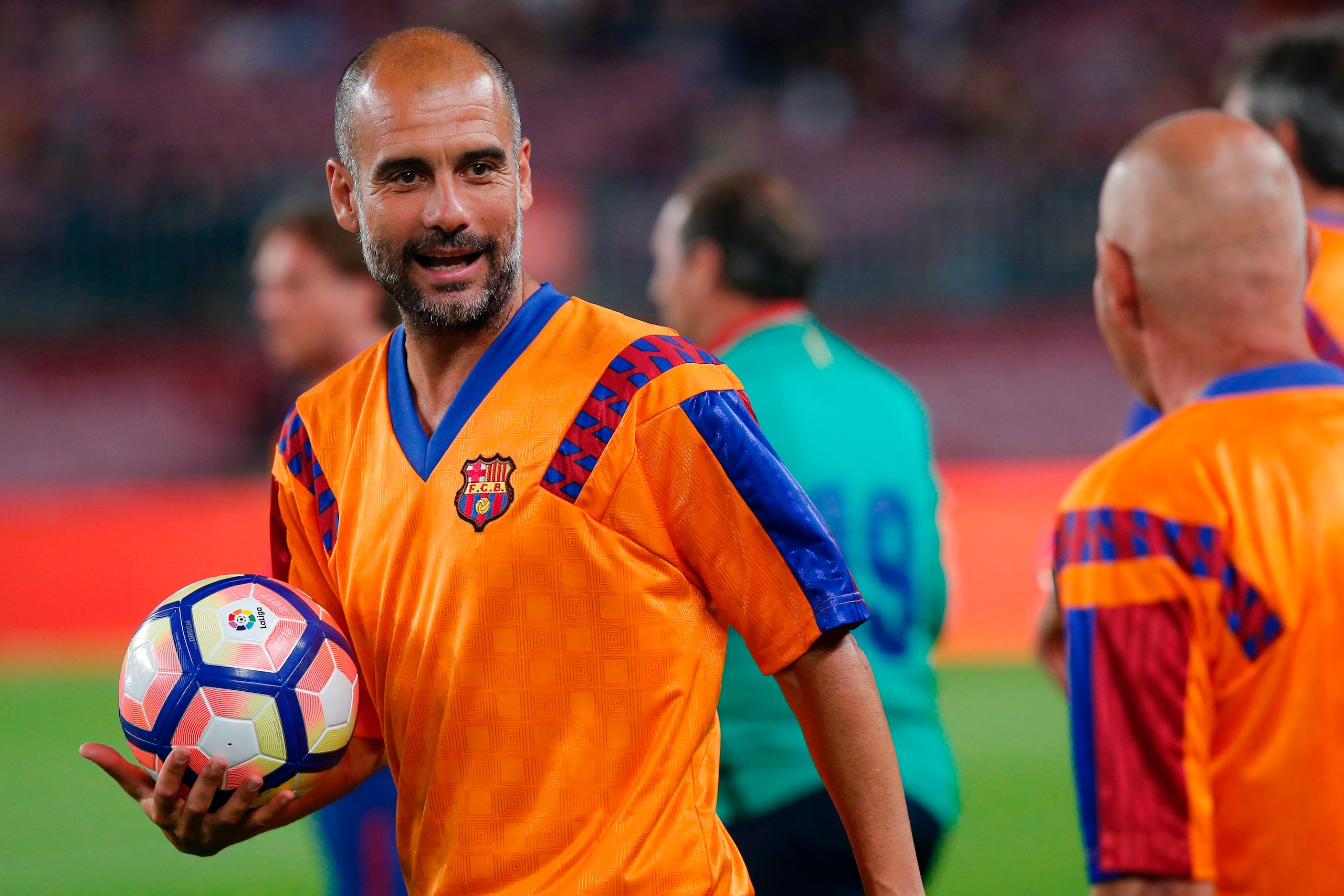 Former FC Barcelona's midfielder Josep Guardiola holds the ball before a tribute match against SL Benfica at the Camp Nou stadium in Barcelona on June 10, 2017 part of celebrations marking the 25th anniversary of Barcelona FCs first Champions League win i