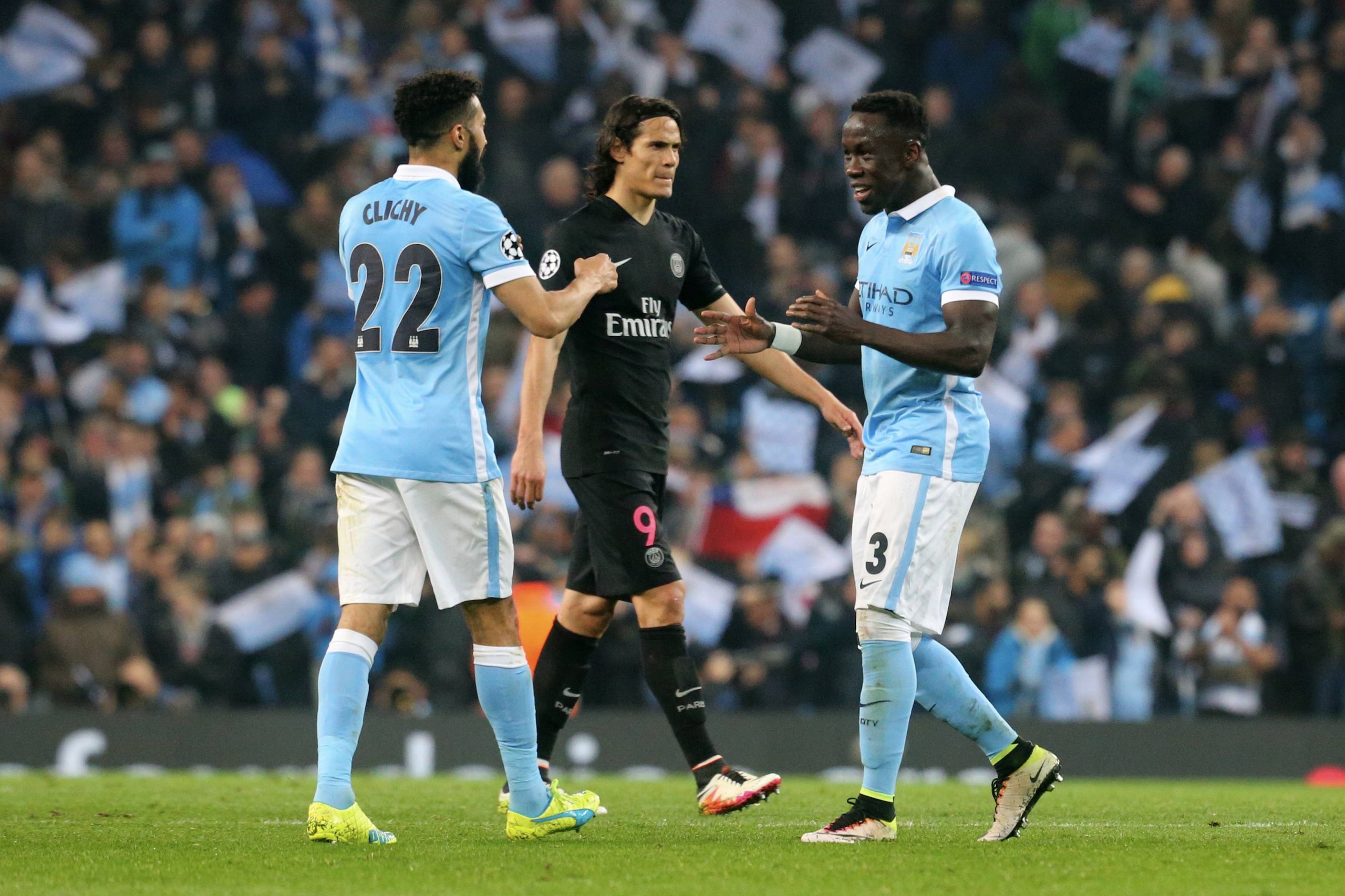 MANCHESTER, ENGLAND - APRIL 12:  Gael Clichy and Bacary Sagna of Manchester City FC celebrate the victory and Edinson Cavani  of Paris Saint-Germain is disapointed during the UEFA Champions League Quarter Final second leg match between Manchester City FC 