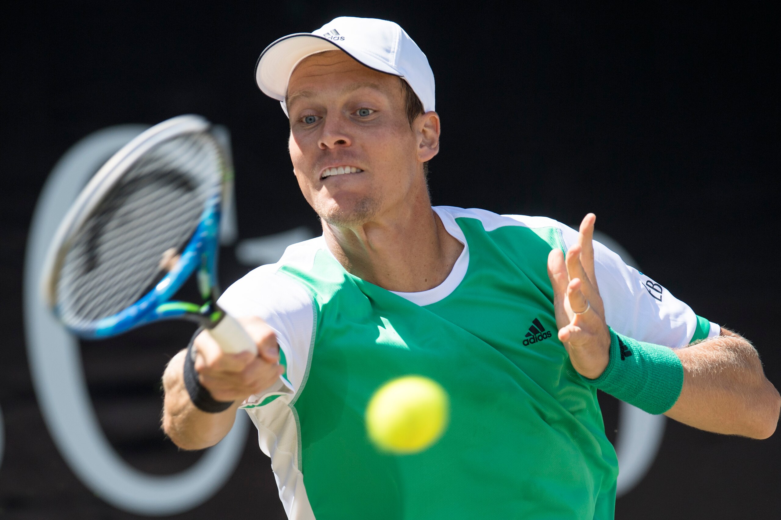 Czech Republic's Tomas Berdych returns the ball to Spain's Feliciano Lopez in their quarterfinal match at the ATP Cup tennis tournament in Stuttgart, southwestern Germany, on June 16, 2017.   / AFP PHOTO / THOMAS KIENZLE        (Photo credit should read T