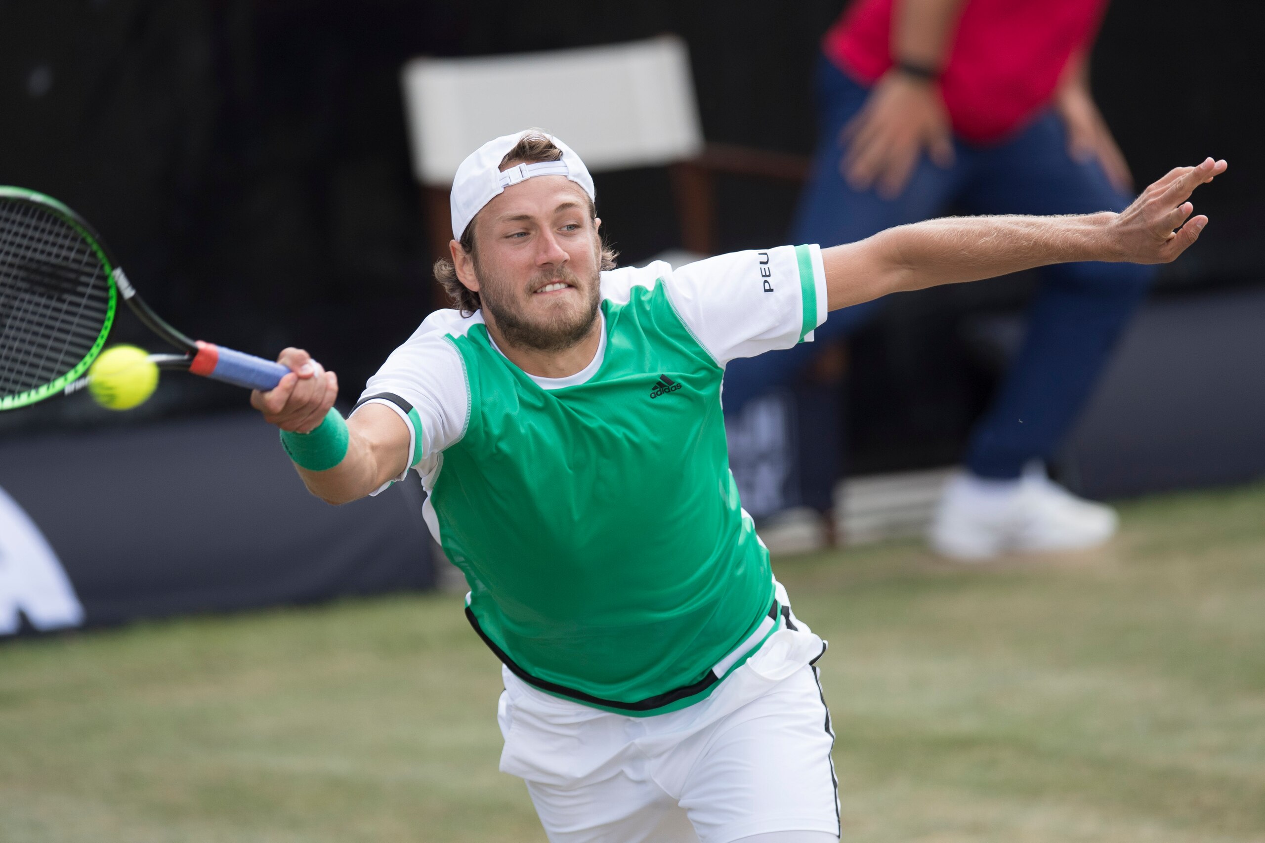 France's Lucas Pouille returns the ball to Germany's Philipp Kohlschreiber in their quarterfinal match at the ATP Mercedes Cup tennis tournament in Stuttgart, southwestern Germany, on June 16, 2017. / AFP PHOTO / THOMAS KIENZLE        (Photo credit should