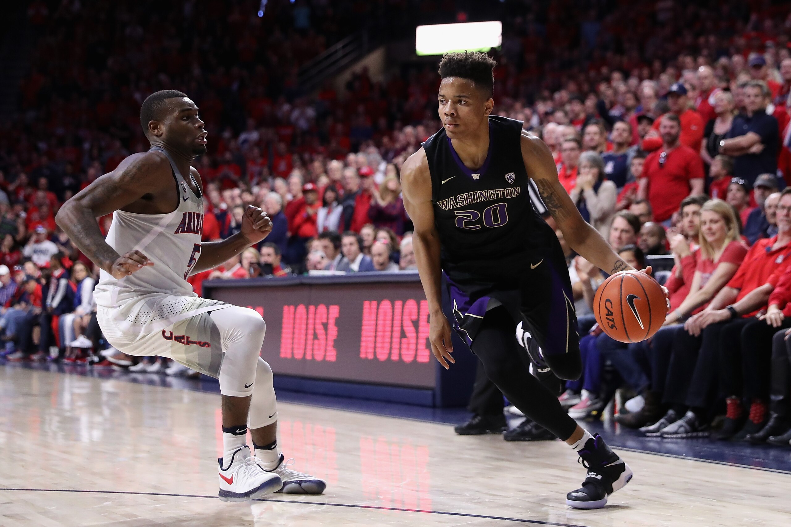 TUCSON, AZ - JANUARY 29:  Markelle Fultz #20 of the Washington Huskies handles the ball against Kadeem Allen #5 of the Arizona Wildcats during the second half of the college basketball game at McKale Center on January 29, 2017 in Tucson, Arizona. The Wild