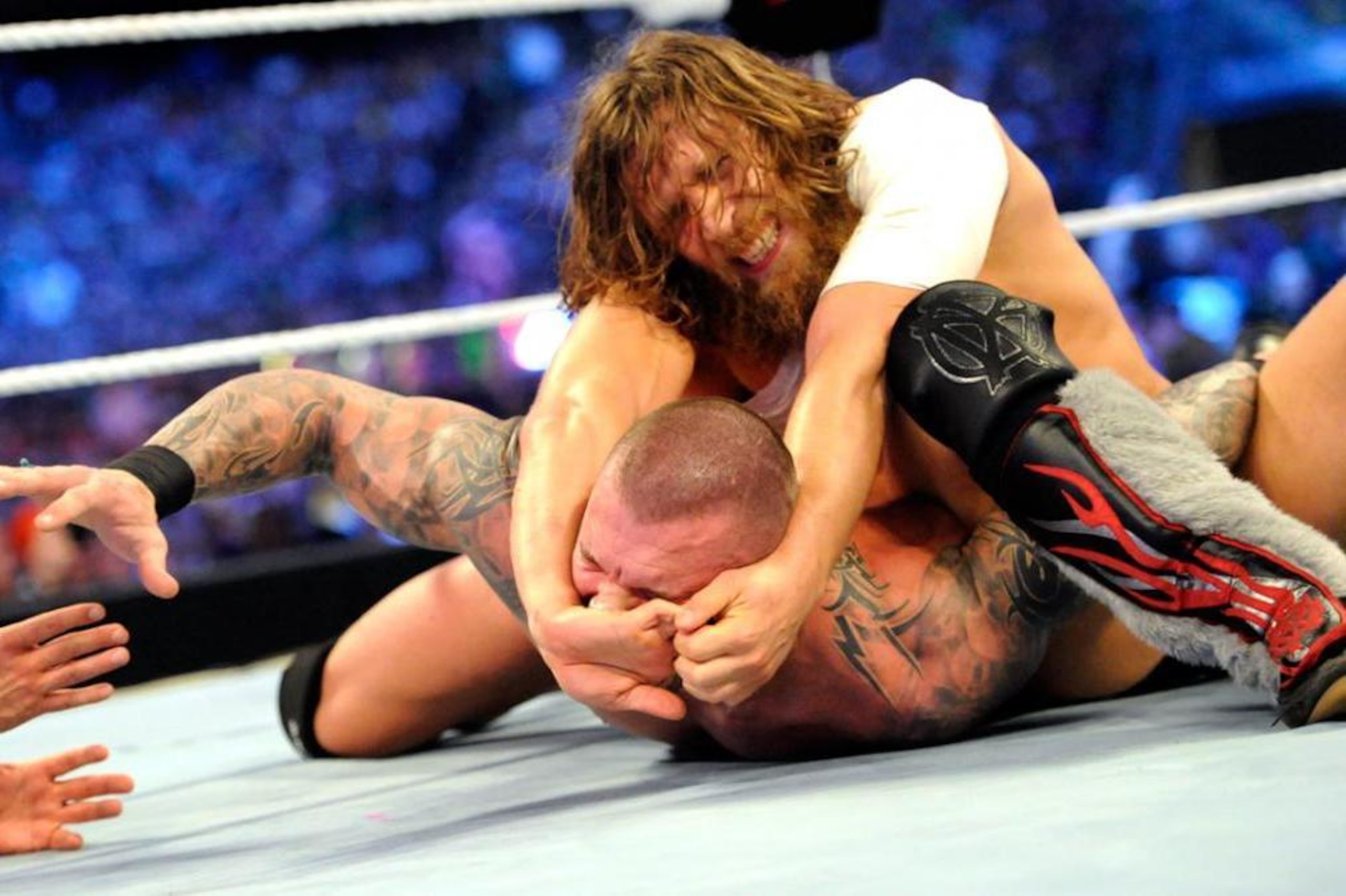 Daniel Bryan traps Randy Orton in the Yes Lock. Daniel Bryan traps Randy Orton in the Yes Lock.