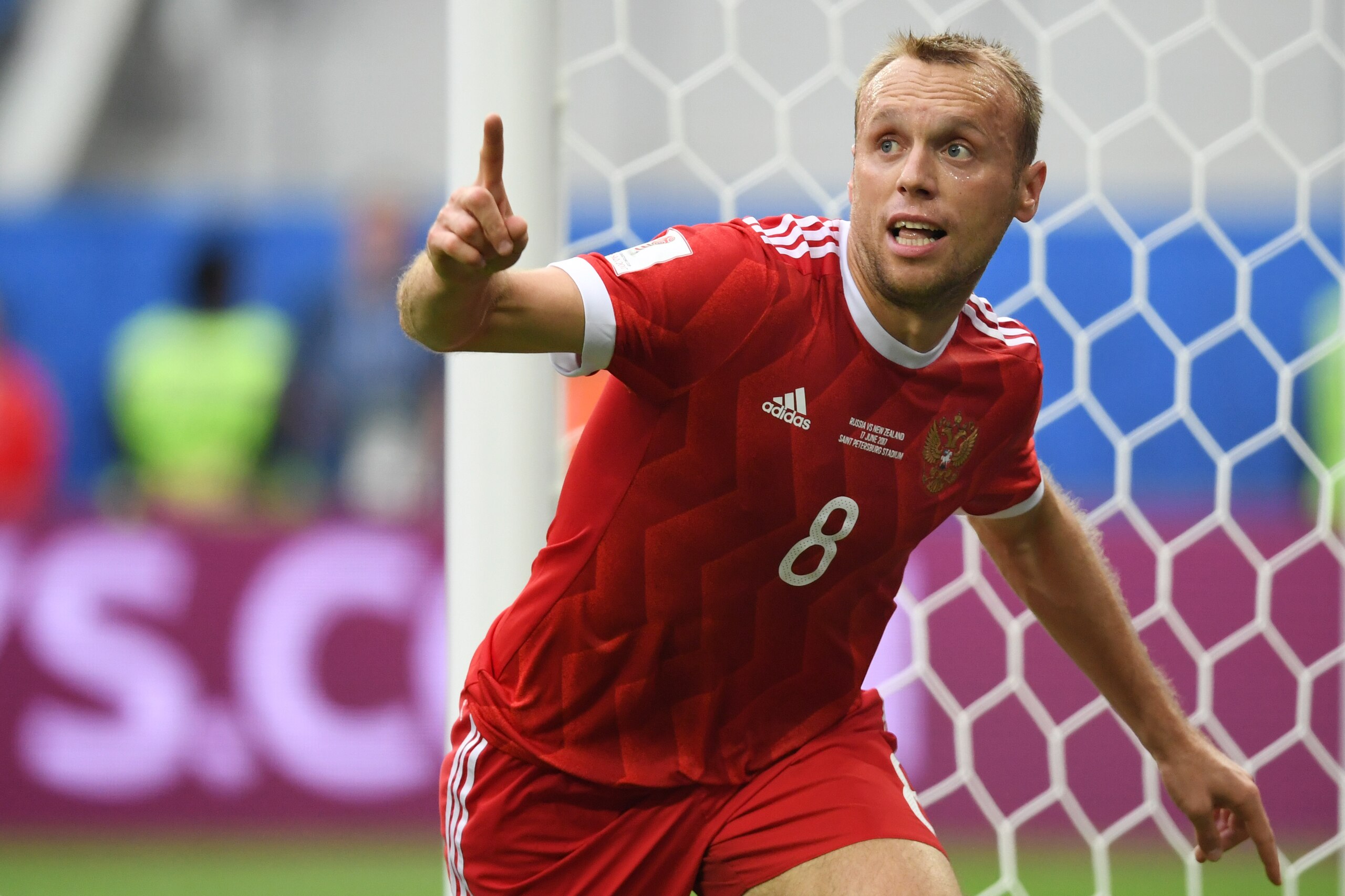 Russia's midfielder Denis Glushakov celebrates after scoring the first goal of the match during the 2017 Confederations Cup group A football match between Russia and New Zealand at the Krestovsky Stadium in Saint-Petersburg on June 17, 2017. / AFP PHOTO / Russia's midfielder Denis Glushakov celebrates after scoring the first goal of the match during the 2017 Confederations Cup group A football match between Russia and New Zealand at the Krestovsky Stadium in Saint-Petersburg on June 17, 2017. / AFP PHOTO /
