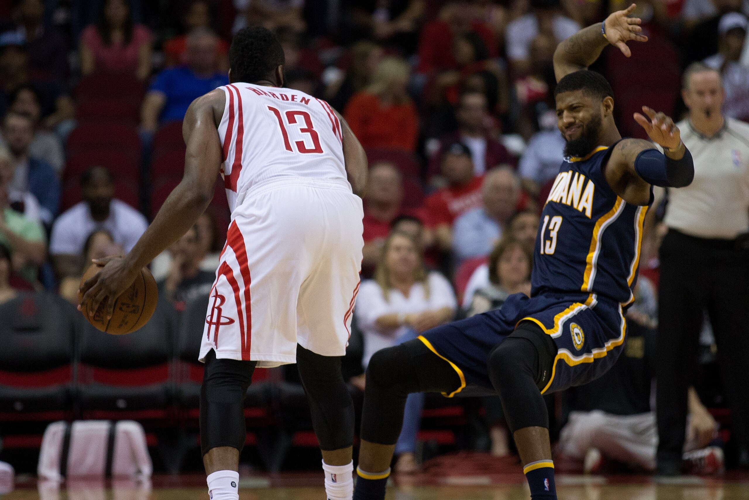 HOUSTON, TX - FEBRUARY 27:  Paul George #13 of the Indiana Pacers falls backward after making conact with James Harden #13 of the Houston Rockets at Toyota Center on February 27, 2017 in Houston, Texas. NOTE TO USER: User expressly acknowledges and agrees