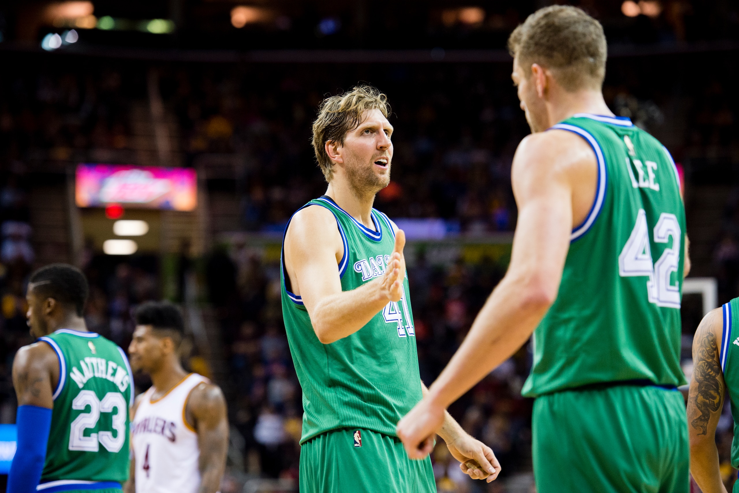 CLEVELAND, OH - MARCH 16: Dirk Nowitzki #41 celebrates with David Lee #42 of the Dallas Mavericks during the first half against the Cleveland Cavaliers at Quicken Loans Arena on March 16, 2016 in Cleveland, Ohio. NOTE TO USER: User expressly acknowledges 