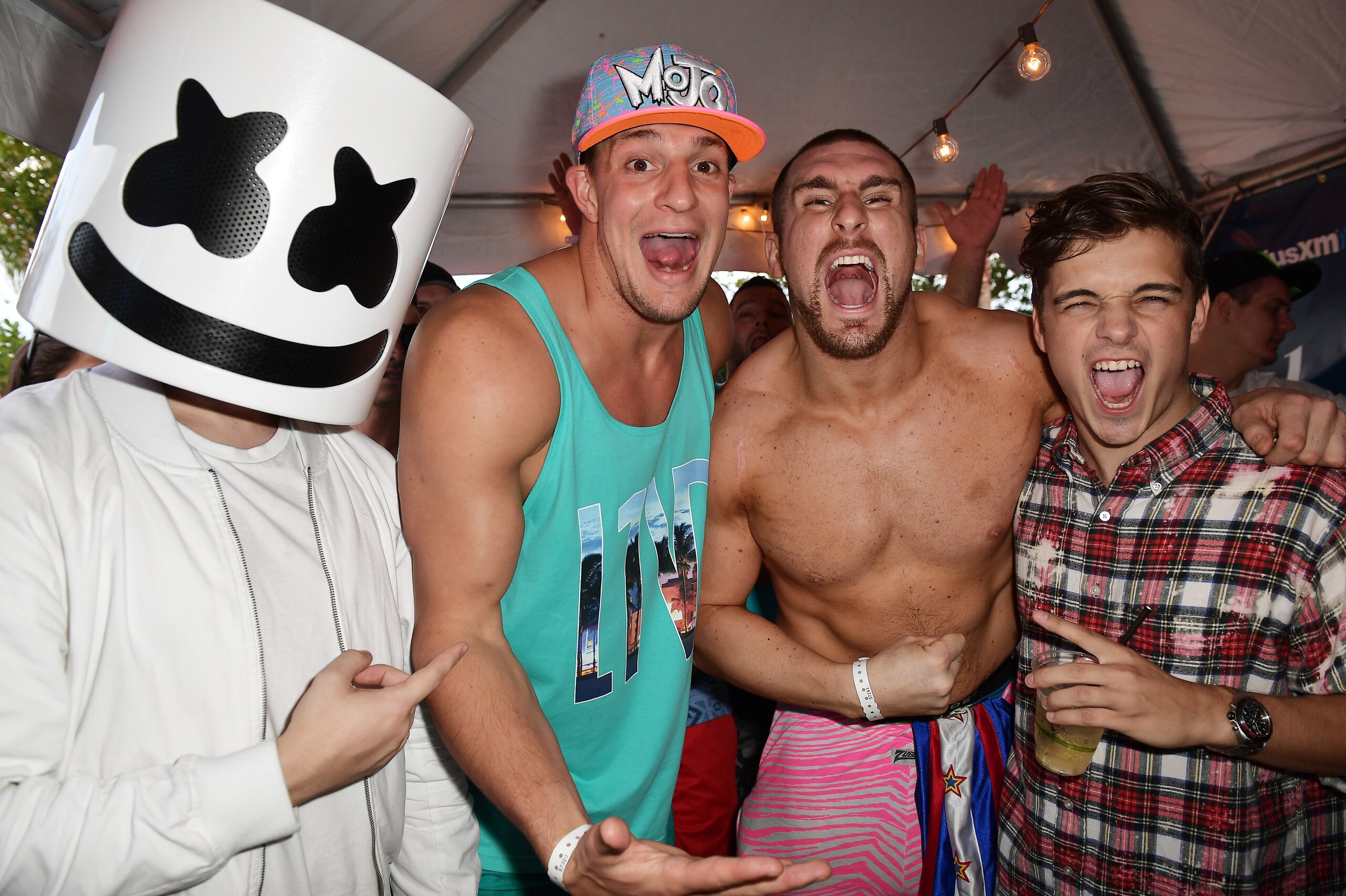 MIAMI, FL - MARCH 23:  Marshmello, New England Patriots tight end Rob Gronkowski, Mojo Rawley, and Martin Garrix attend the SiriusXM Music Lounge at 1 Hotel South Beach on March 23, 2017 in Miami, Florida.  (Photo by Gustavo Caballero/Getty Images for Sir
