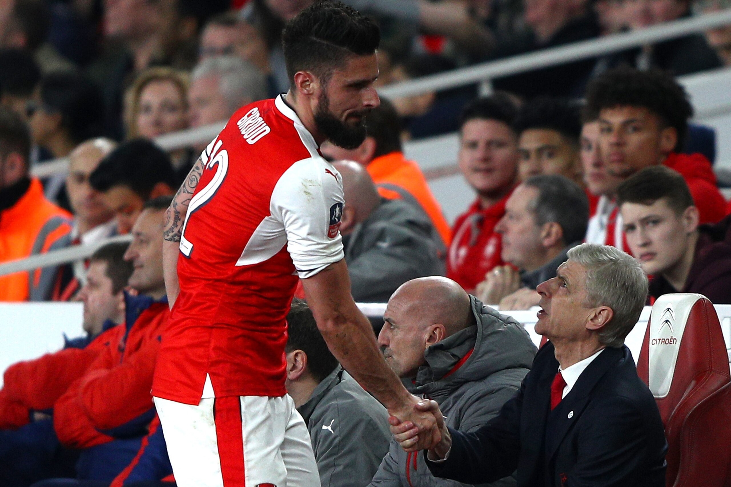 LONDON, ENGLAND - MARCH 11:  Olivier Giroud of Arsenal (L) shakes hands with Arsene Wenger, Manager of Arsenal (R) after he is subbed during The Emirates FA Cup Quarter-Final match between Arsenal and Lincoln City at Emirates Stadium on March 11, 2017 in 