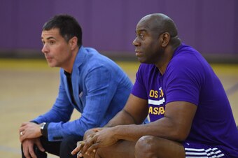EL SEGUNDO, CA - JUNE 15:  Magic Johnson, president of basketball operations for the Los Angeles Lakers, and Rob Pelinka, General Manager of the Los Angeles Lakers, look on during the Markelle Fultz workout at Toyota Sports Center on June 15, 2017 in El S