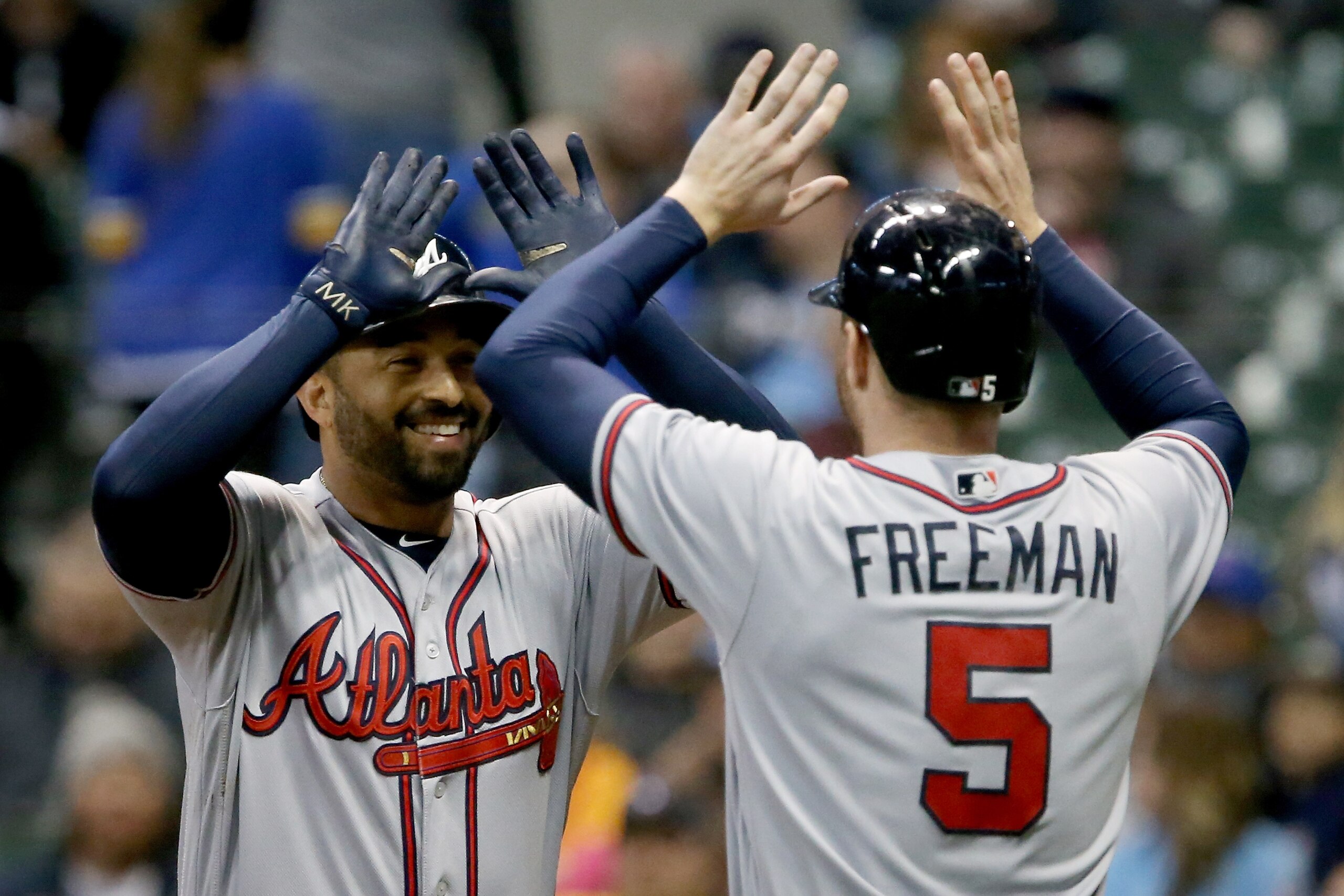 MILWAUKEE, WI - APRIL 29:  Freddie Freeman #5 and Matt Kemp #27 of the Atlanta Braves celebrate after Kemp hit a home run in the eighth inning against the Milwaukee Brewers at Miller Park on April 29, 2017 in Milwaukee, Wisconsin. (Photo by Dylan Buell/Ge