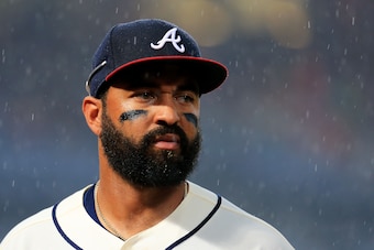 ATLANTA, GA - SEPTEMBER 18: Matt Kemp #27 of the Atlanta Braves walks back to the dugout as rain falls in the seventh inning against the Washington Nationals at Turner Field on September 18, 2016 in Atlanta, Georgia. (Photo by Daniel Shirey/Getty Images)