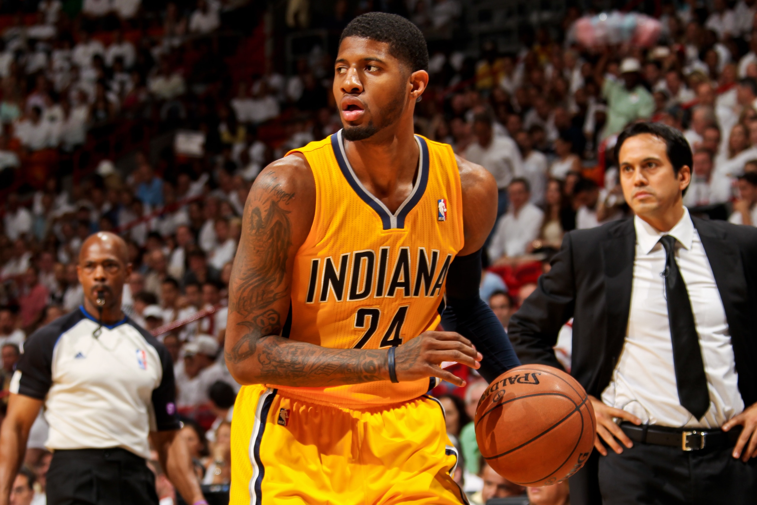 MIAMI, FL - MAY 24: Paul George #24 of the Indiana Pacers controls the ball as Head Coach Erik Spoelstra of the Miami Heat looks on in Game Two of the Eastern Conference Finals during the 2013 NBA Playoffs on May 24, 2013 at American Airlines Arena in Mia